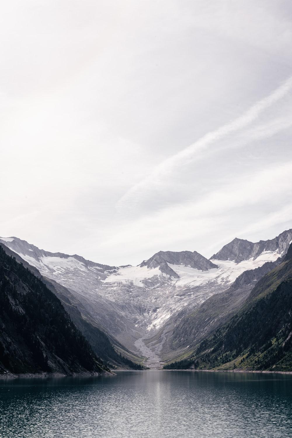 1000x1499 black and white mountains under white sky during daytime photo
