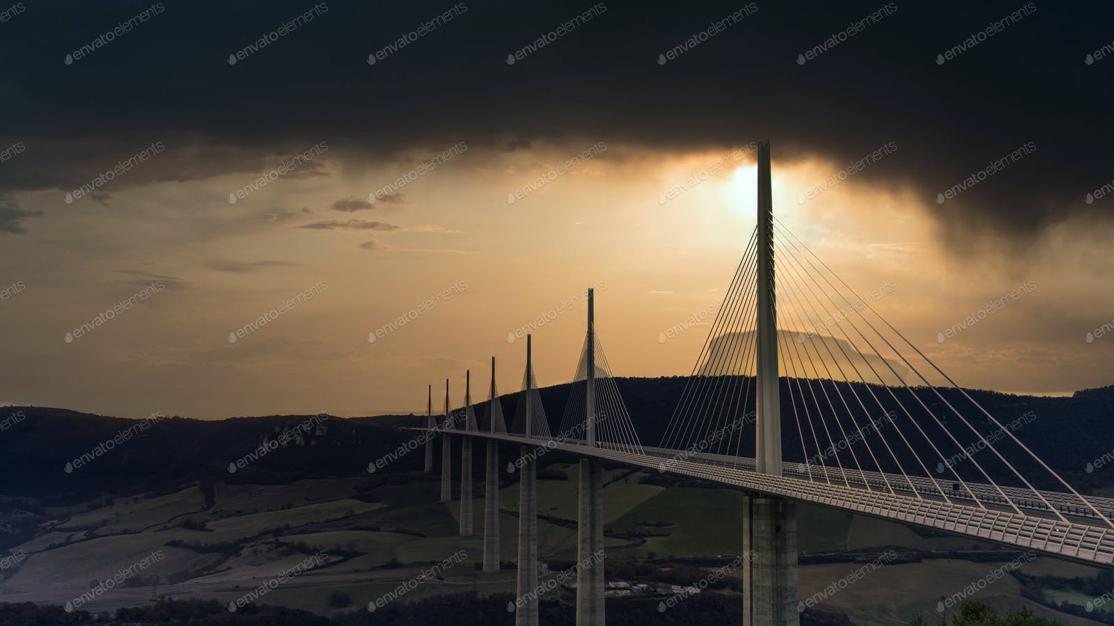 1600x900 Dramatic View Over Millau Bridge in France photo by baspentrubas on Envato Elements
