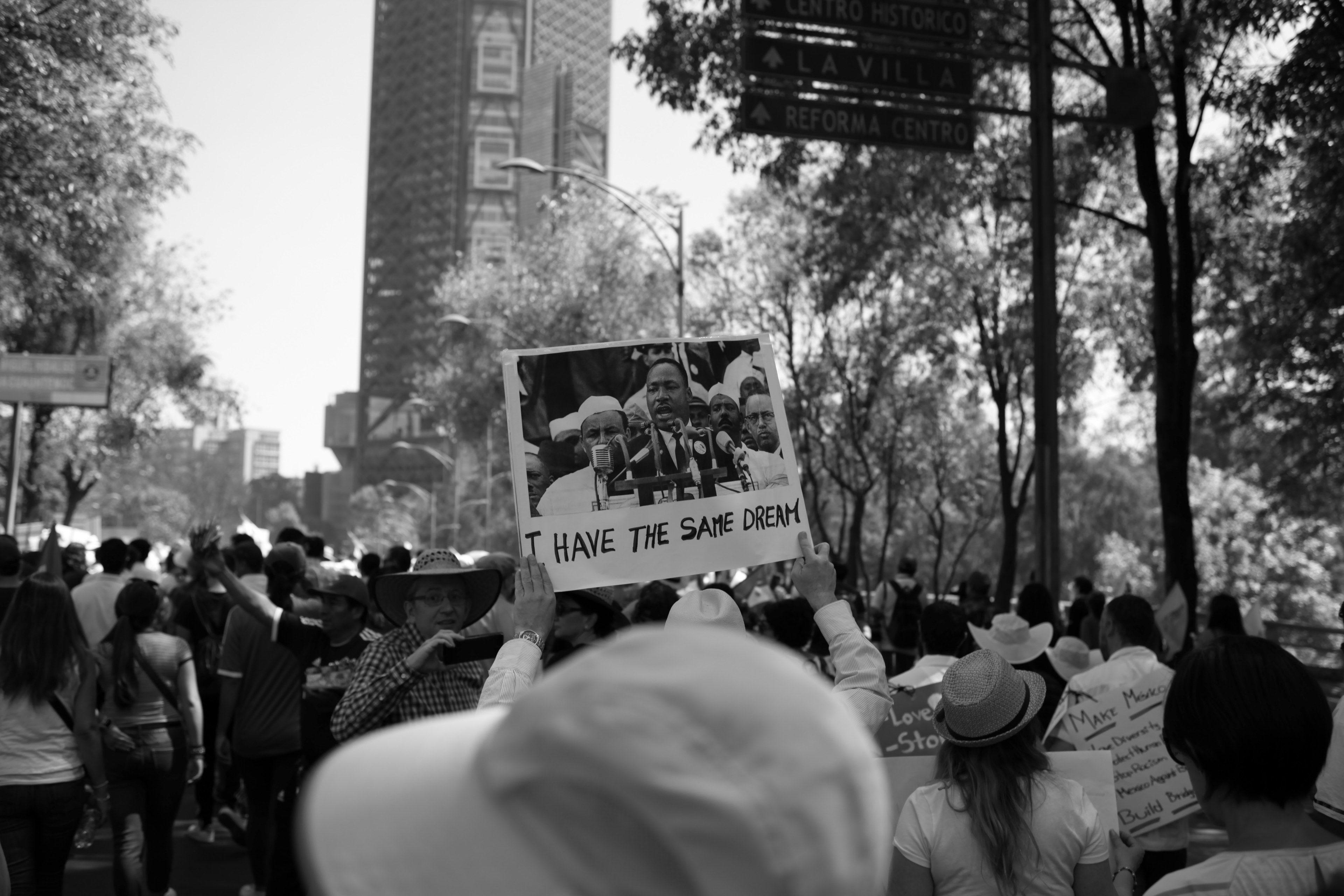 3840x2560 a crowd at a protest in mexico city and a sign picturing martin