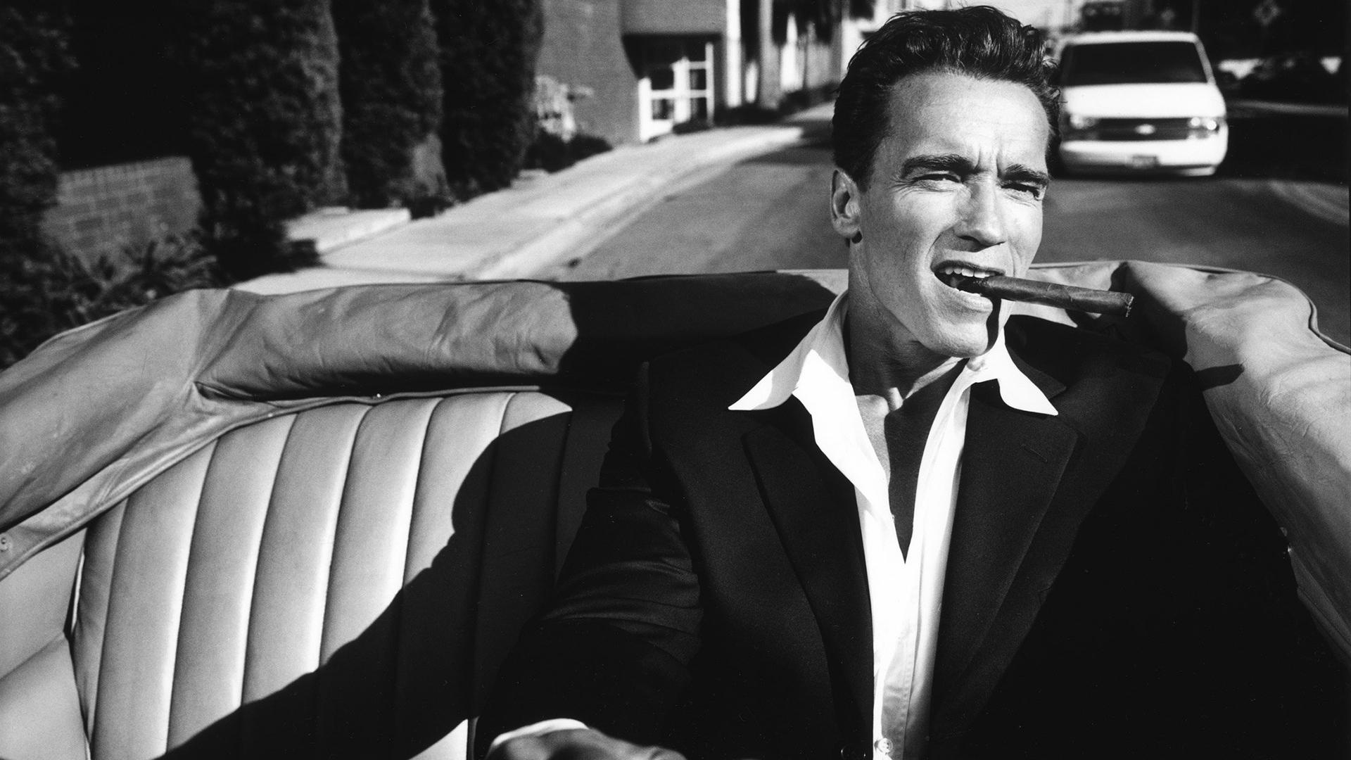 1920x1080 #shadow, #suits, #shirt, #men, #photography, #Cabrio, #car, #Arnold Schwarzenegger, #cigars, #actor, #vintage, #monochrome, #driving, wallpaper HD Wallpaper