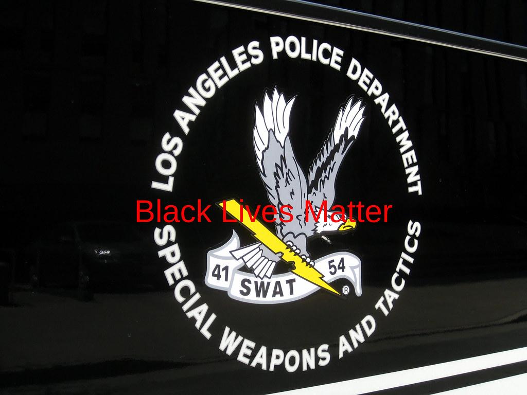 1024x768 LAPD funeral. LAPD SWAT logo on truck