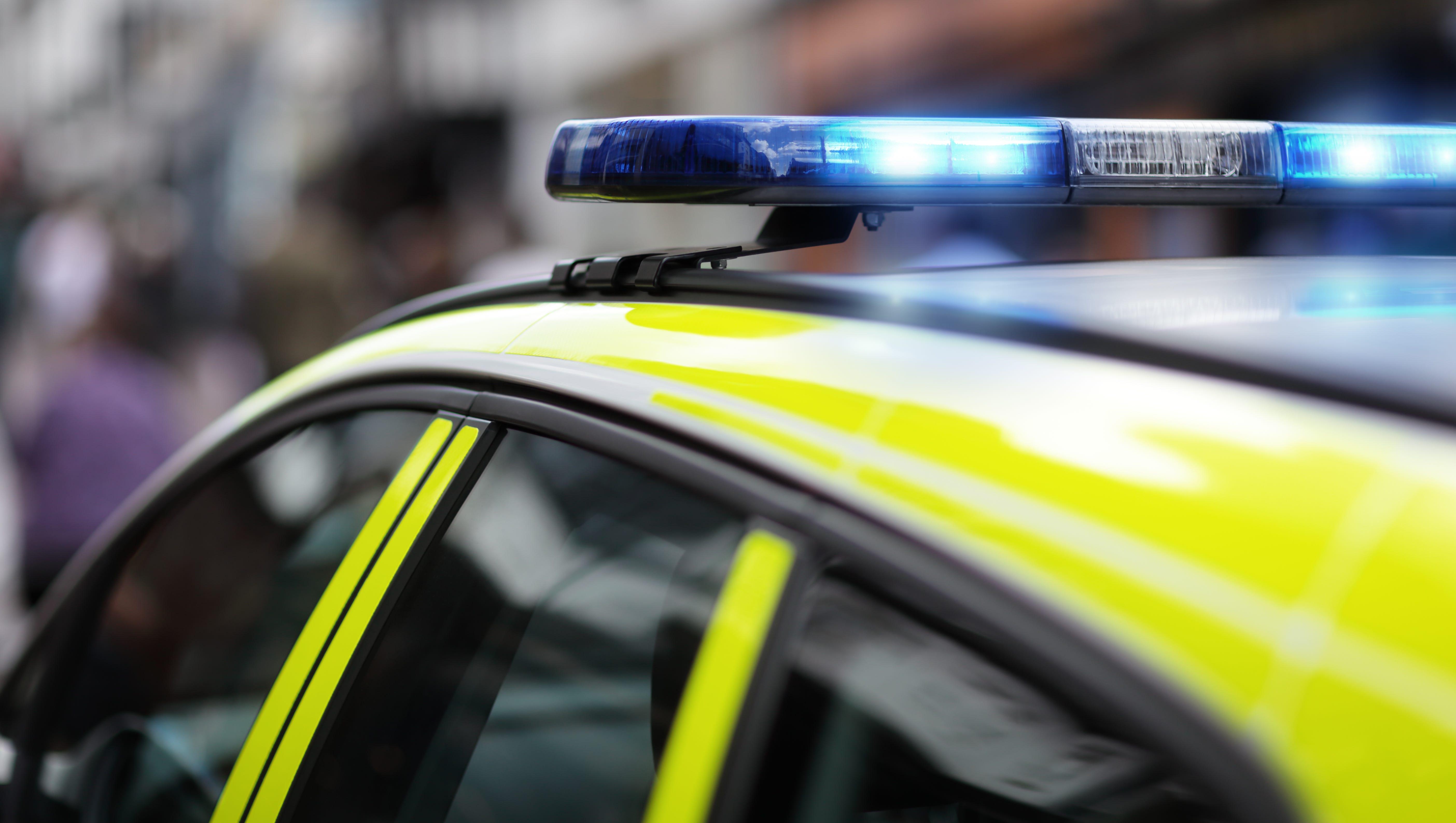 5616x3173 British police officer grabs van dangling from bridge