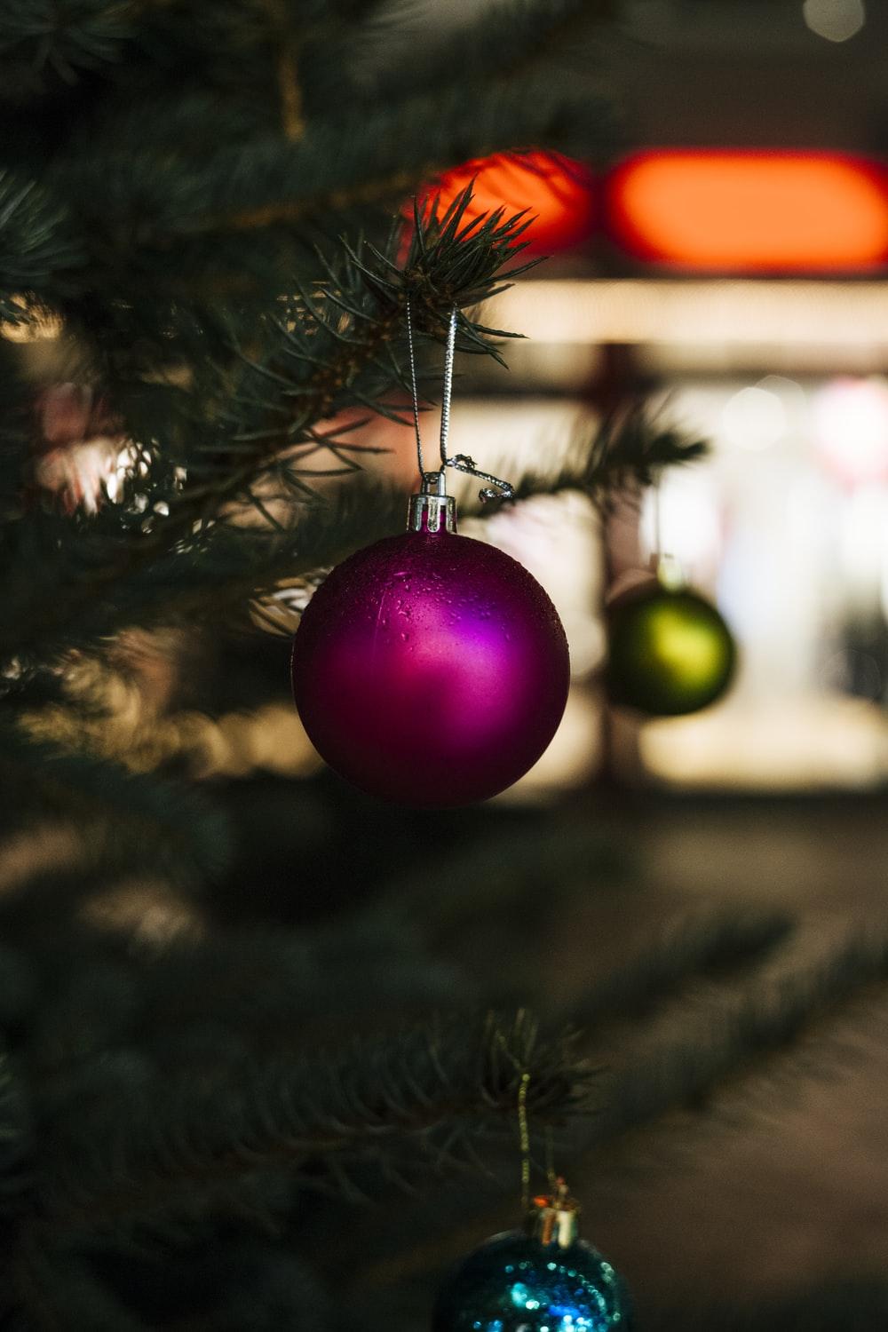 1000x1500 Close Up Selective Focus Shot Of Purple Bauble Hanging On Christmas Tree Photo