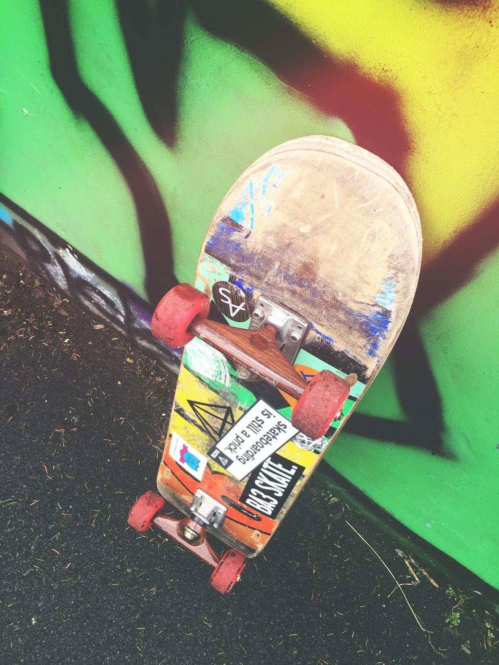 1000x1333 skateboard on graffiti wall photo
