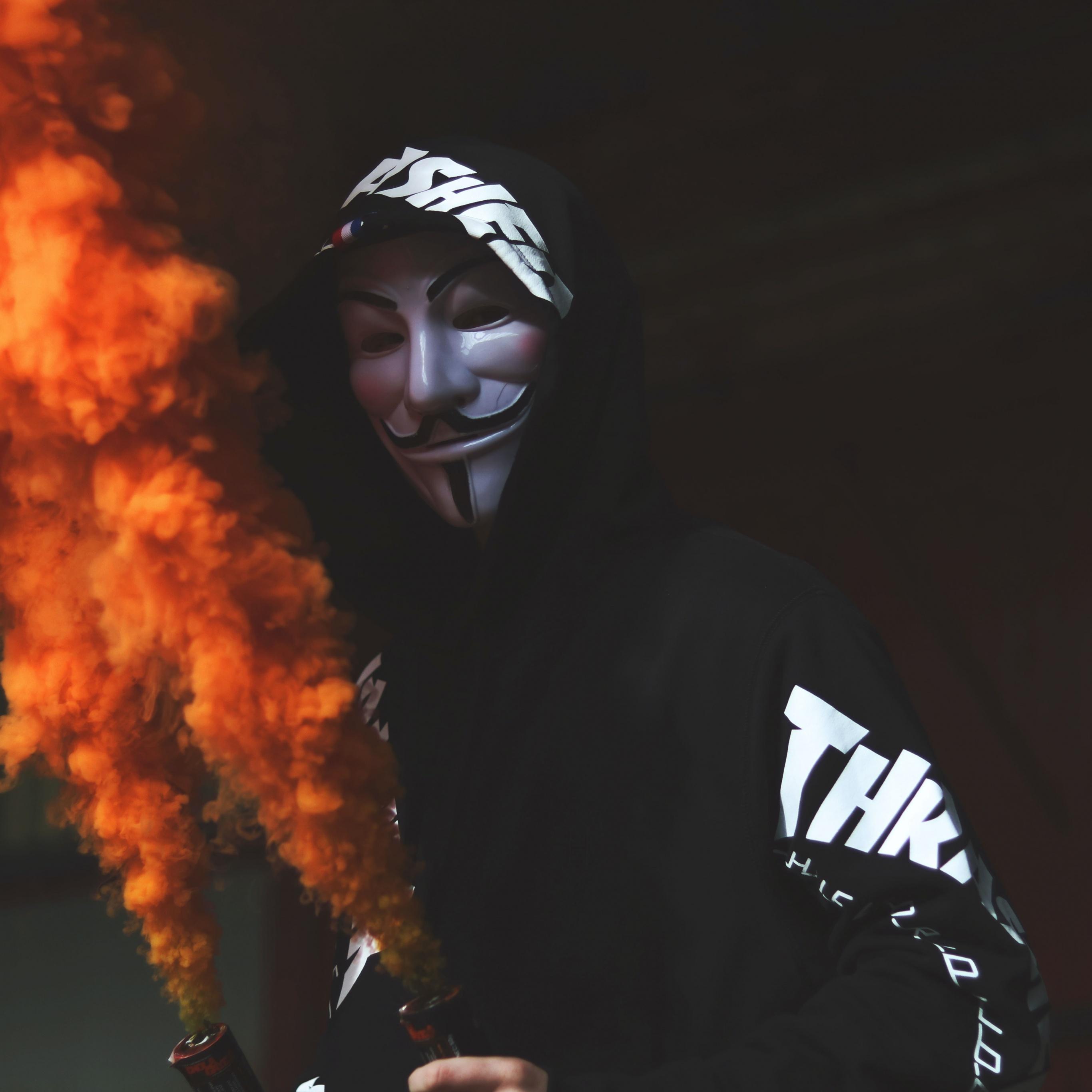 2732x2732 Guy Fawkes Mask Wallpaper 4K, Man In Mask, Black Hoodie, Orange Smoke, Black Dark