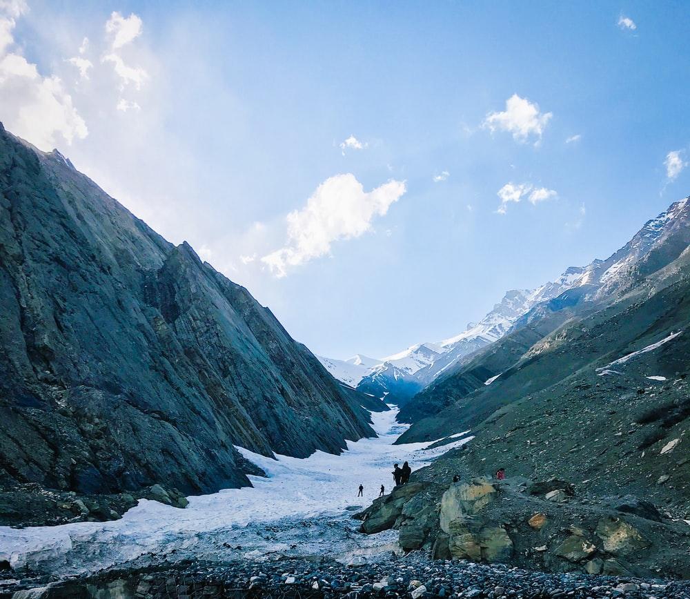 1000x868 people standing near river photo