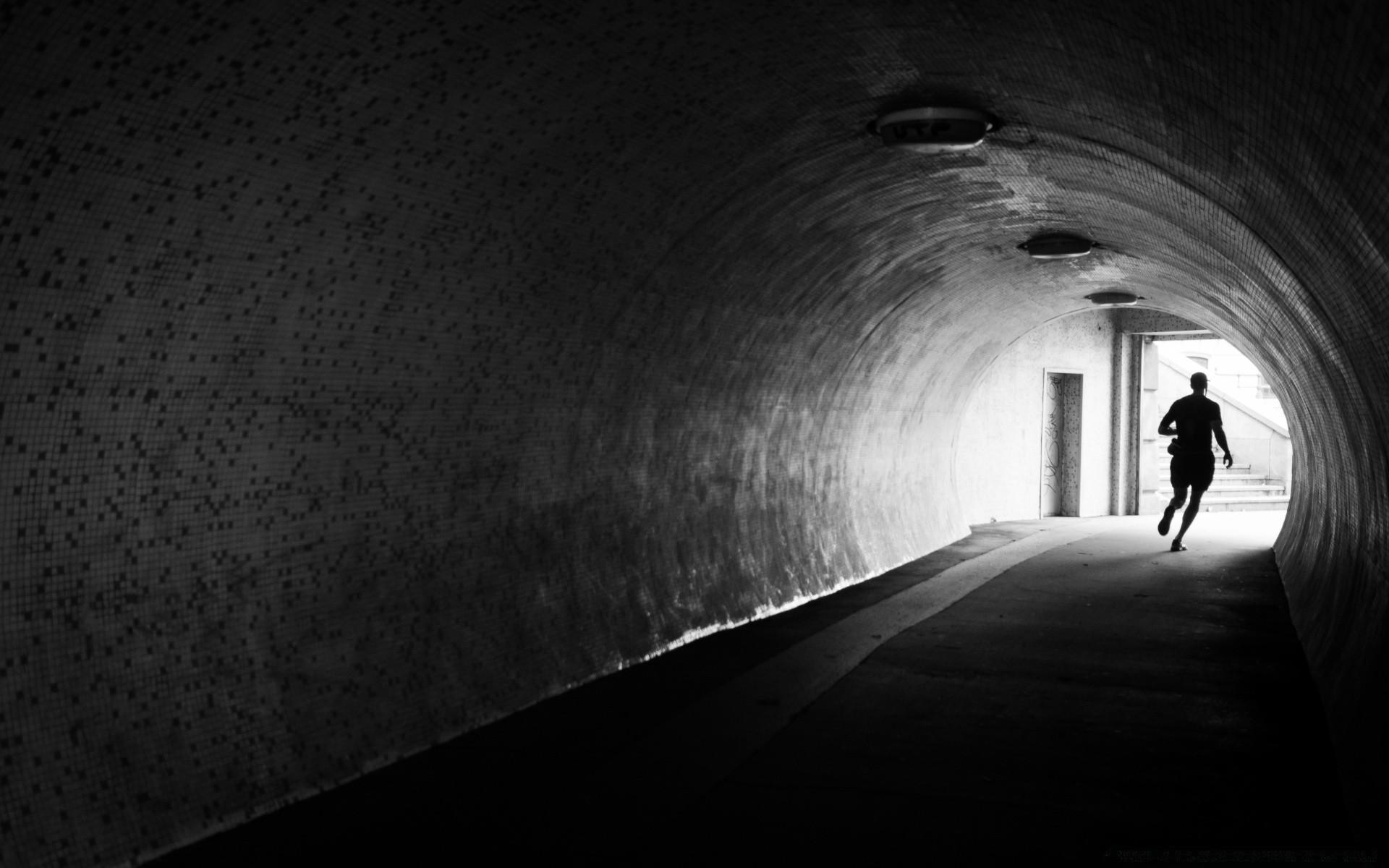 1920x1200 A man running out of a dark tunnel phone background image