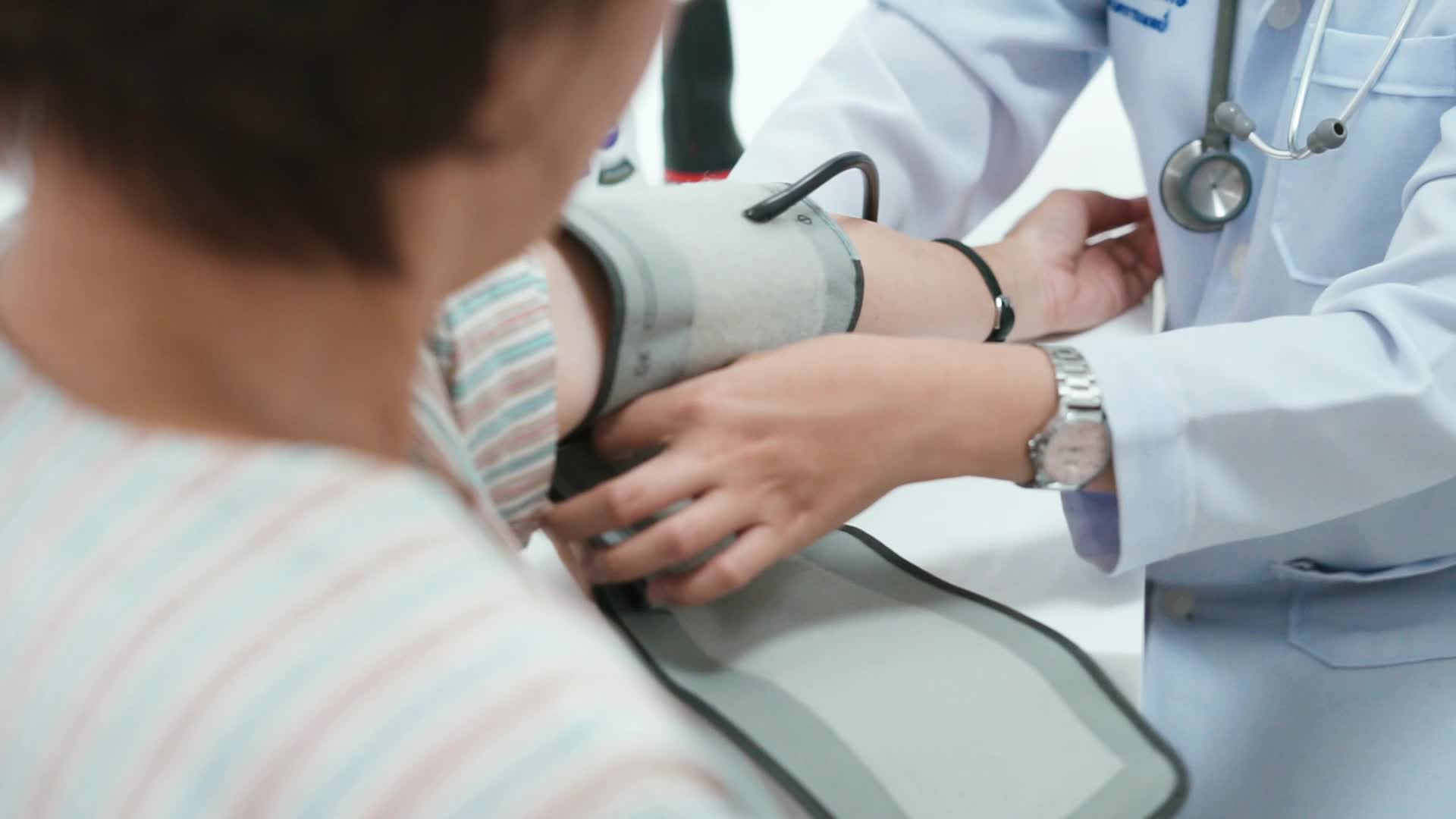 1920x1080 Close Up Doctor Checking Patient's Blood Pressure
