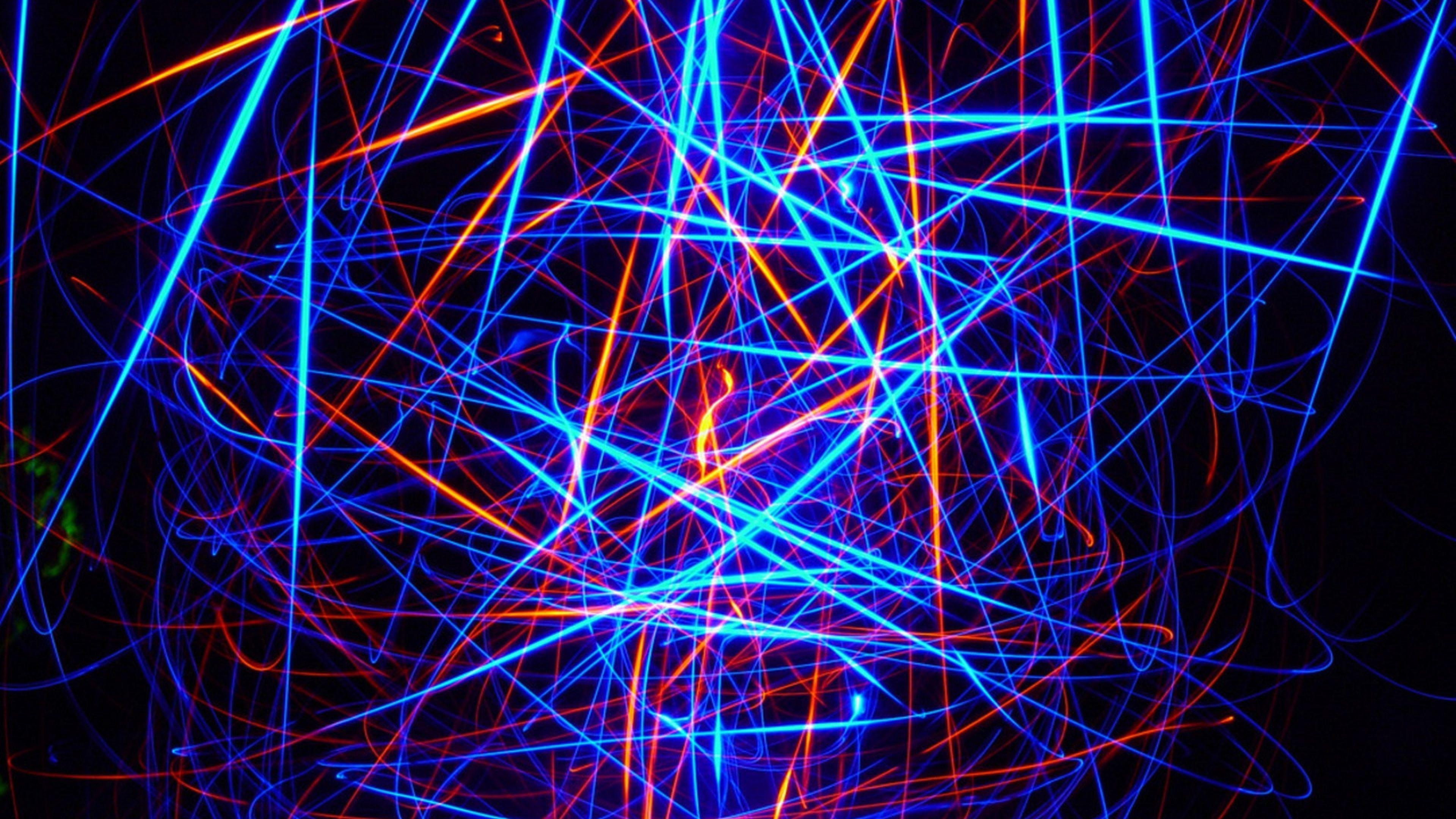 Free Photo  Cosmic background of blackblue and red laser lights  perfect  for a digital wallpaper