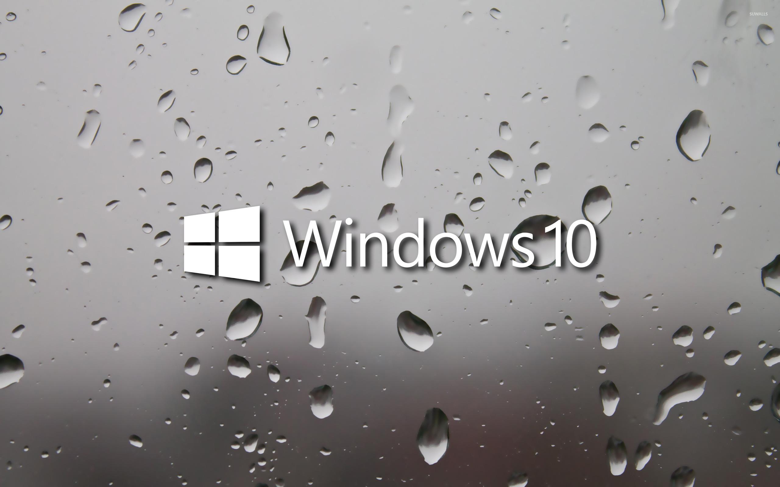 2560x1600 Windows 10 white text logo on a wet window wallpaper wallpaper