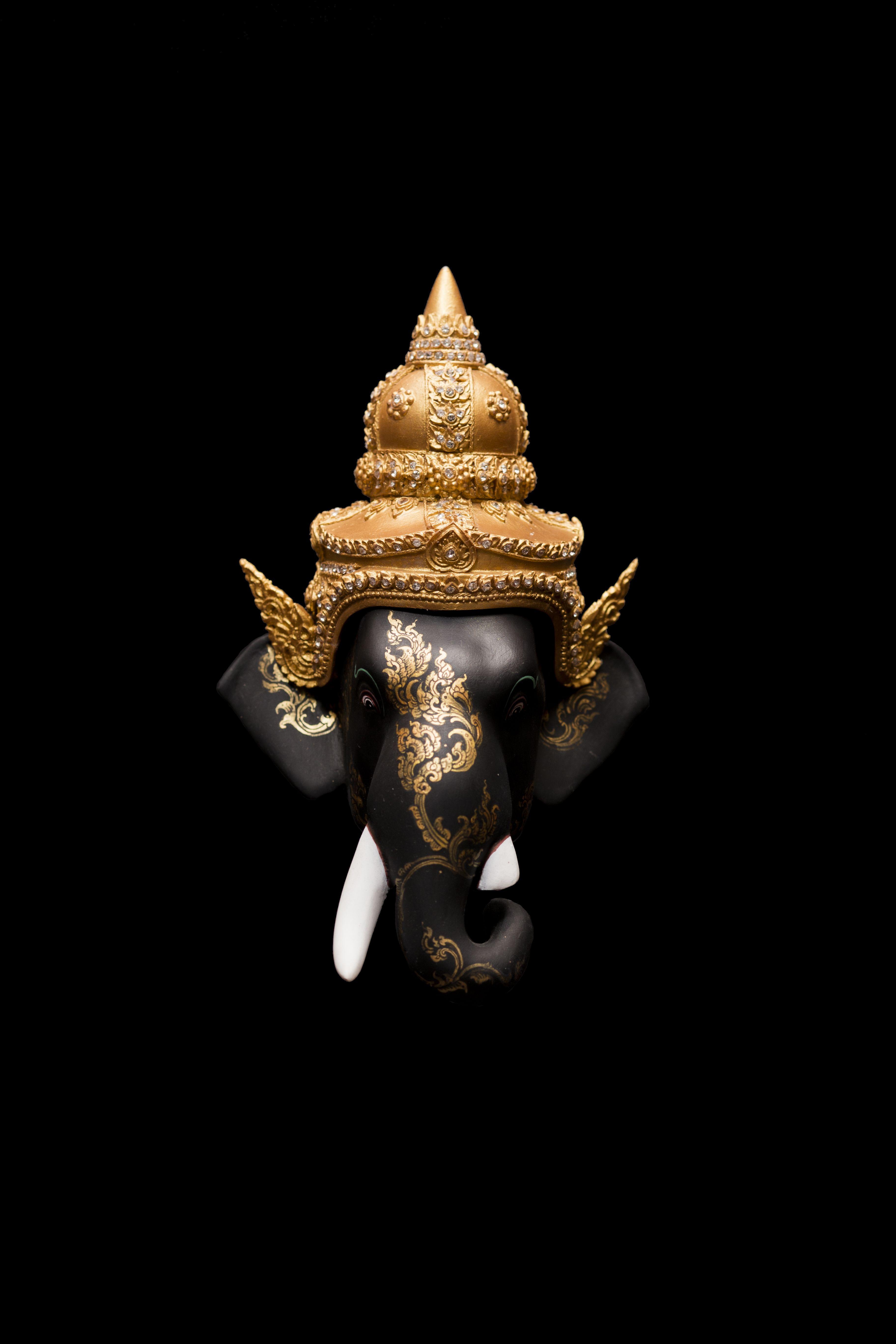 Generative AI on statue of Lord Ganesha , Ganesha Festival. Hindu religion  and Indian celebration of Diwali festival concept on dark, red, yellow  background and copy space 23490240 Stock Photo at Vecteezy