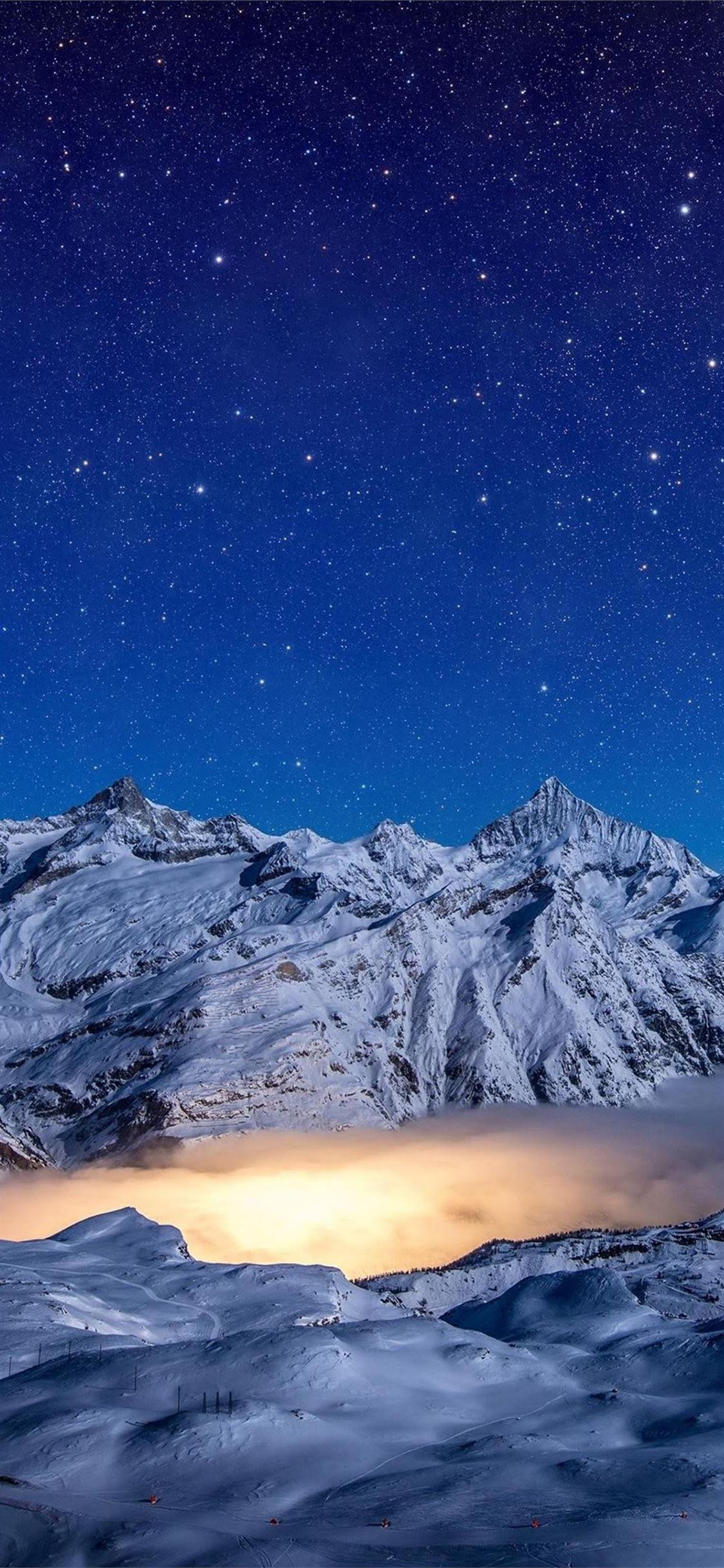 1125x2436 starry night snow covered mountains 4k #snow #mountains #nature k #iPhone11Wallpaper. Mountain wallpaper, Aesthetic wallpaper, Nebula wallpaper