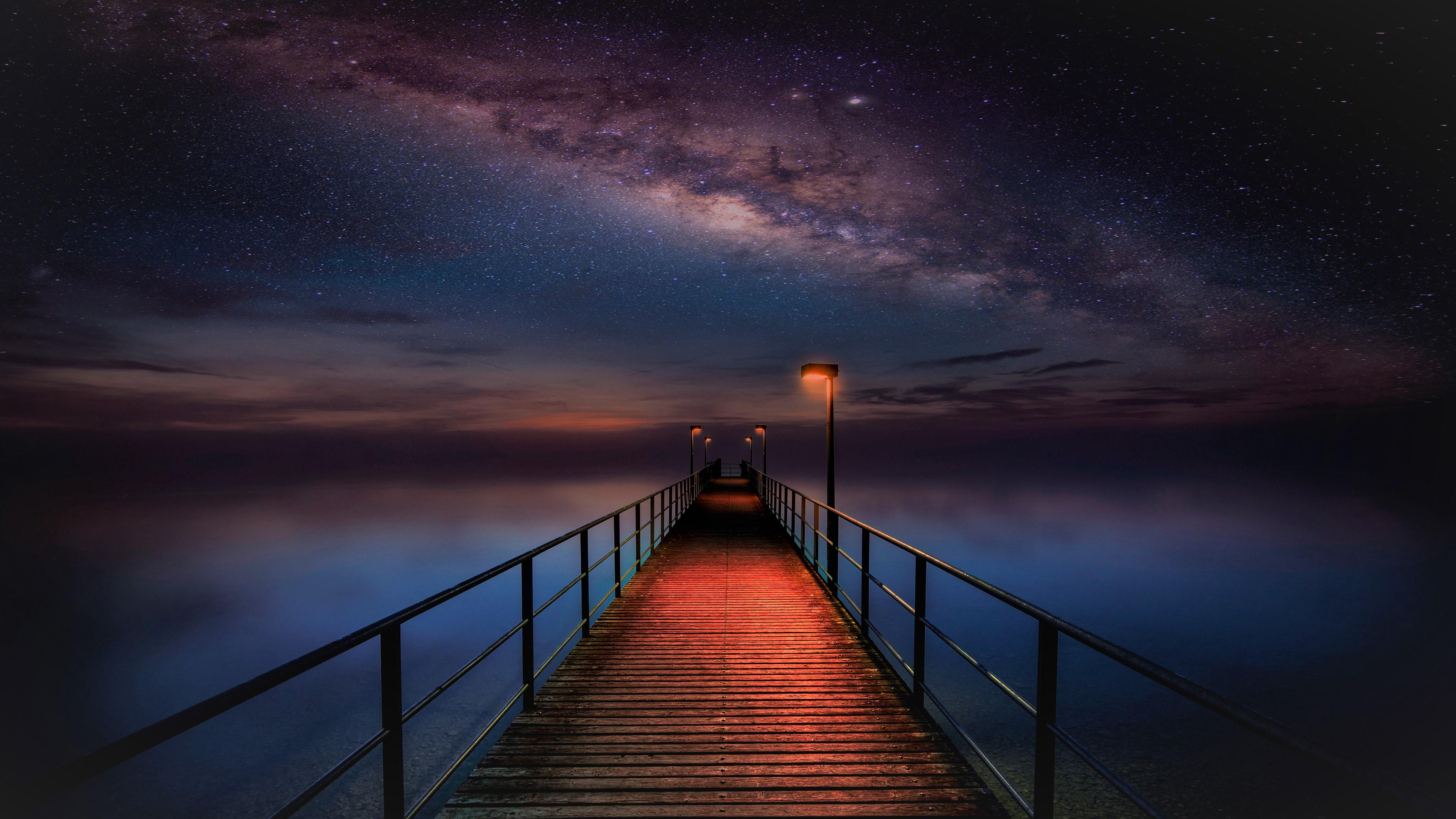 3840x2160 Ocean Pier under Milky Way Sky 4k Ultra HD Wallpaper