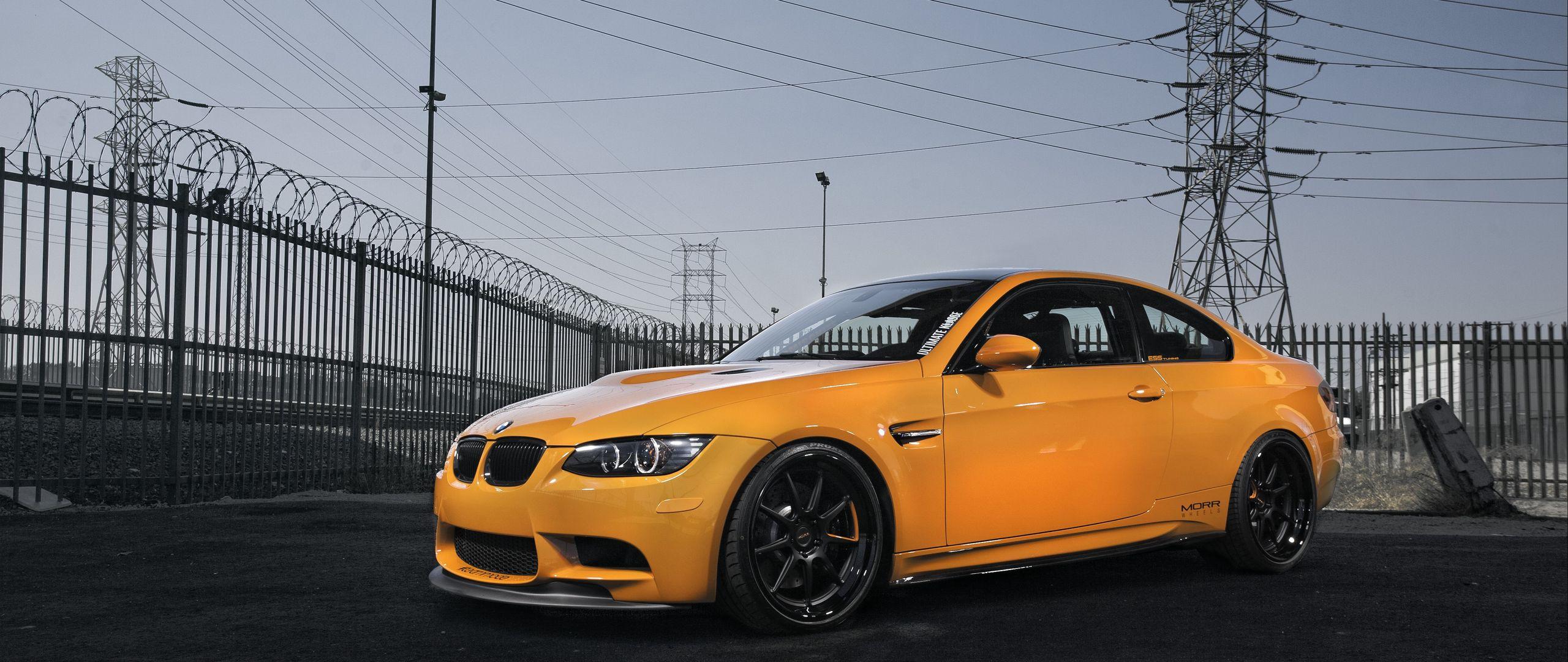 2560x1080 Download wallpaper 2560x1080 bmw, m e orange, power lines dual wide 1080p HD background