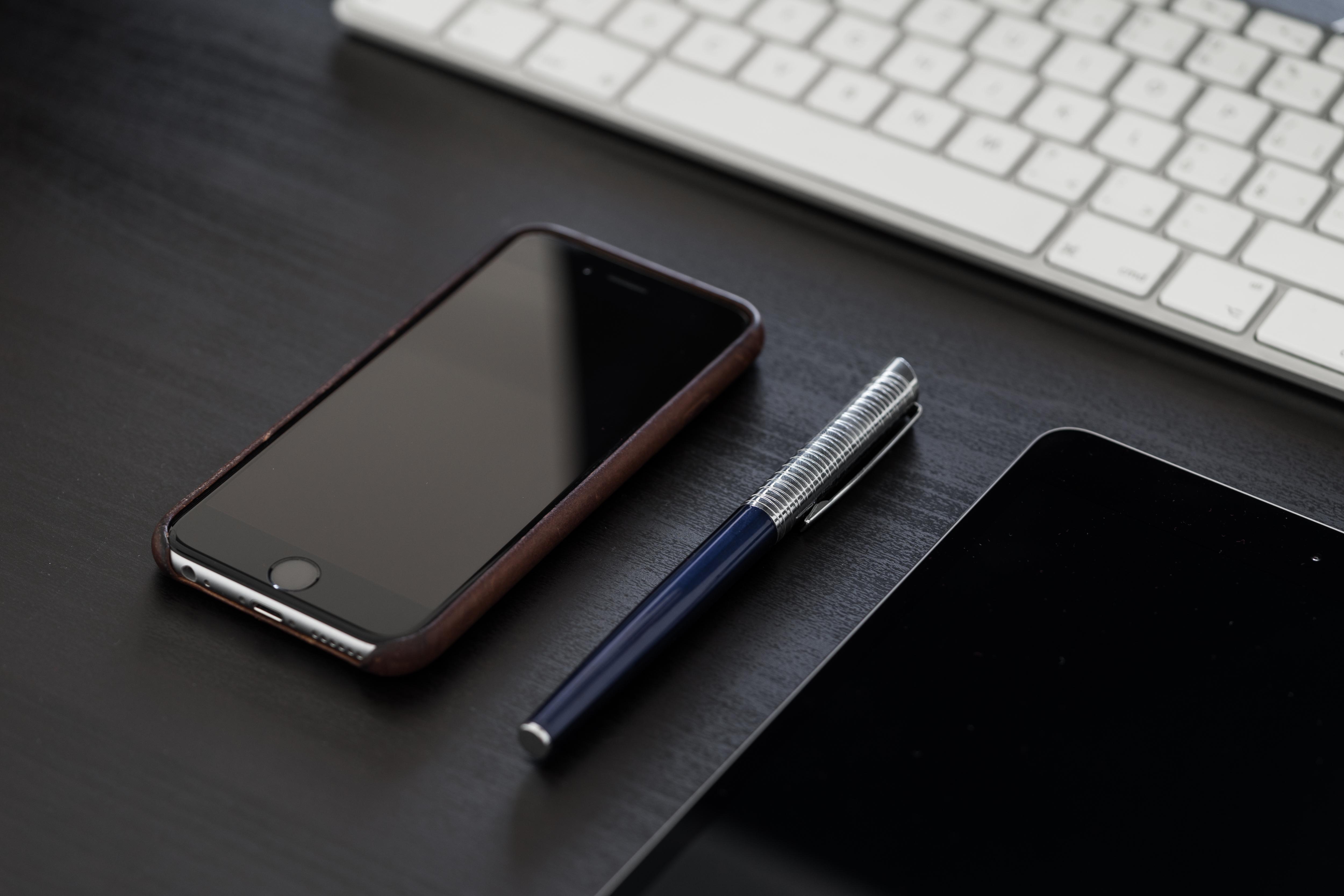 5000x3333 Black iPhone on Black Office Desk Free
