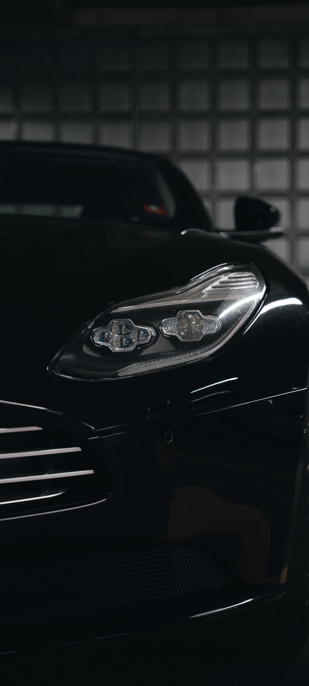 1080x2400 Black Car Grill Wallpaper