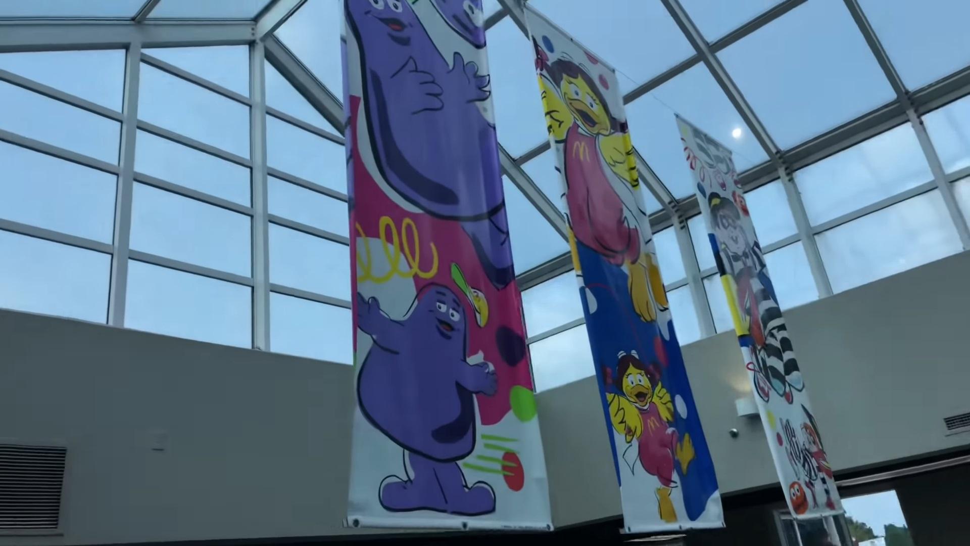 1920x1080 nonstandard mcdonald's second floor, accessible via elevator, featured banners of mcdonaldland characters. a mac tonight piano animatronic (picture c, not on location) was featured, later retrofitted to hamburglar (picture