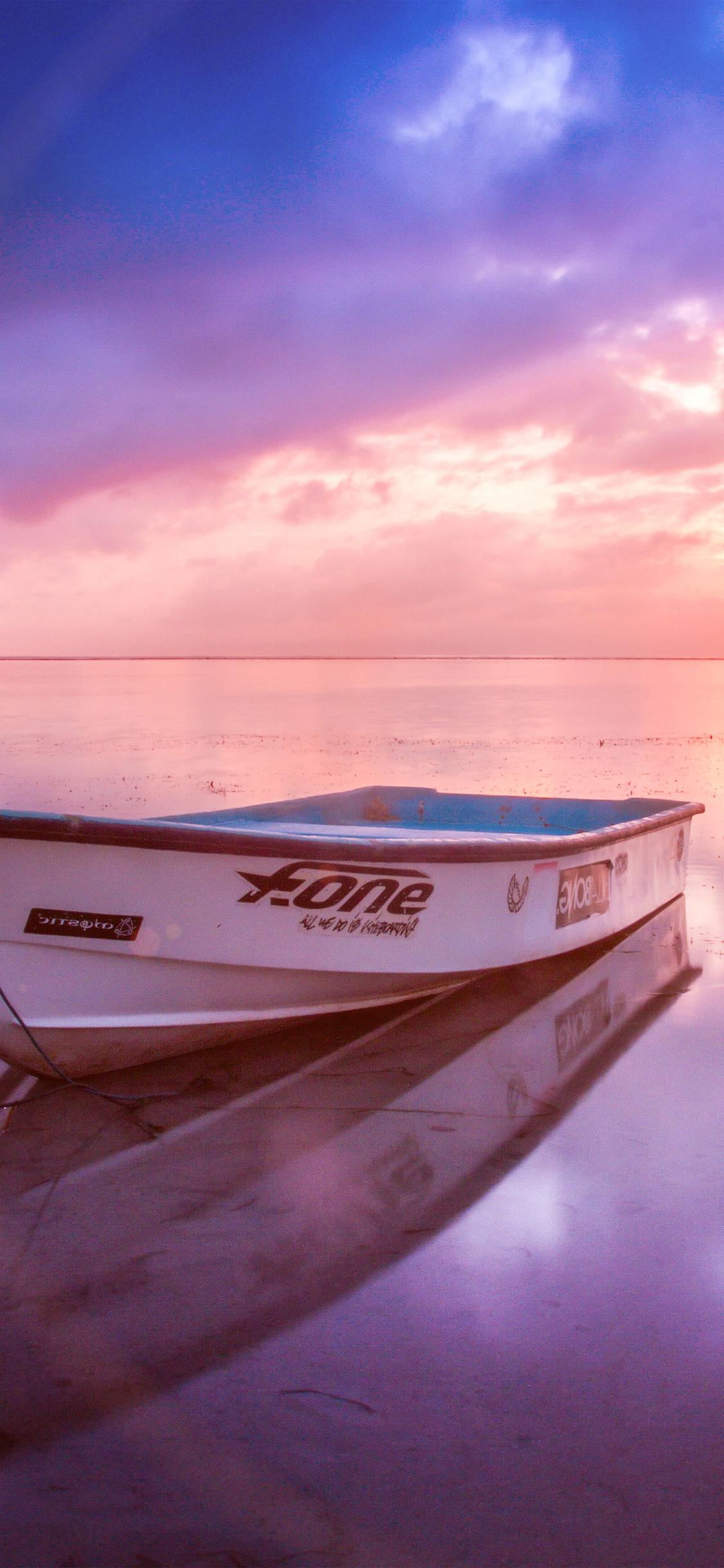 1125x2436 iPhone X wallpaper. nature sea beach boat alone sunset blue pink flare
