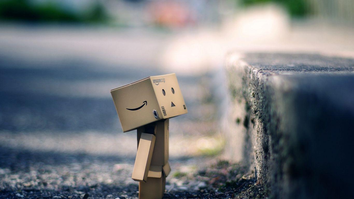 1366x768 Download wallpaper 1366x768 danboard, cardboard robot, box, pavement, asphalt tablet, laptop HD background