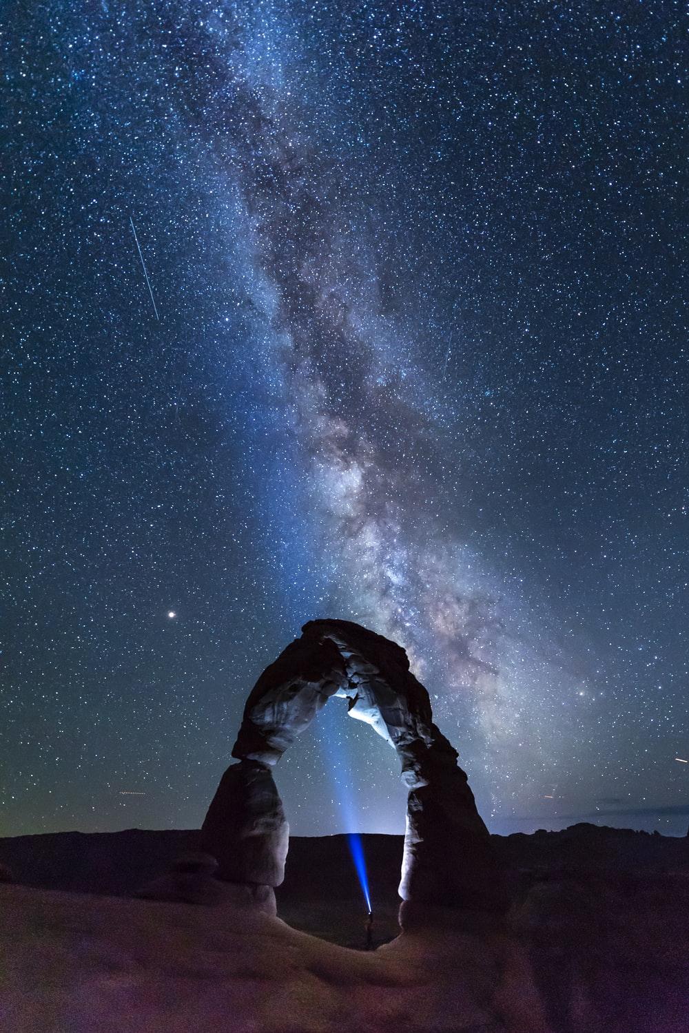 1000x1500 natural arch viewing milky way during night time photo