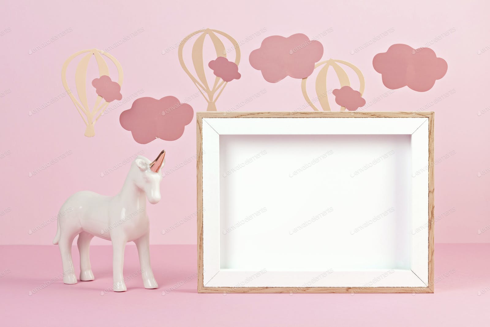 1600x1067 Cute white unicorn over the pink pastel background with clouds and baloons photo by OksaLy on Envato Elements