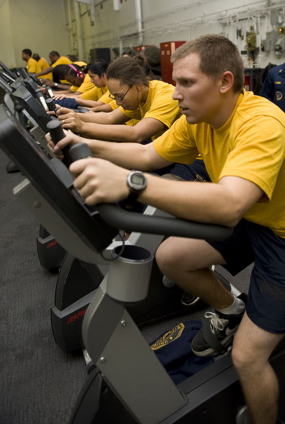 910x1351 Group Of People Exercising, Cycling, Men, Women, Gym