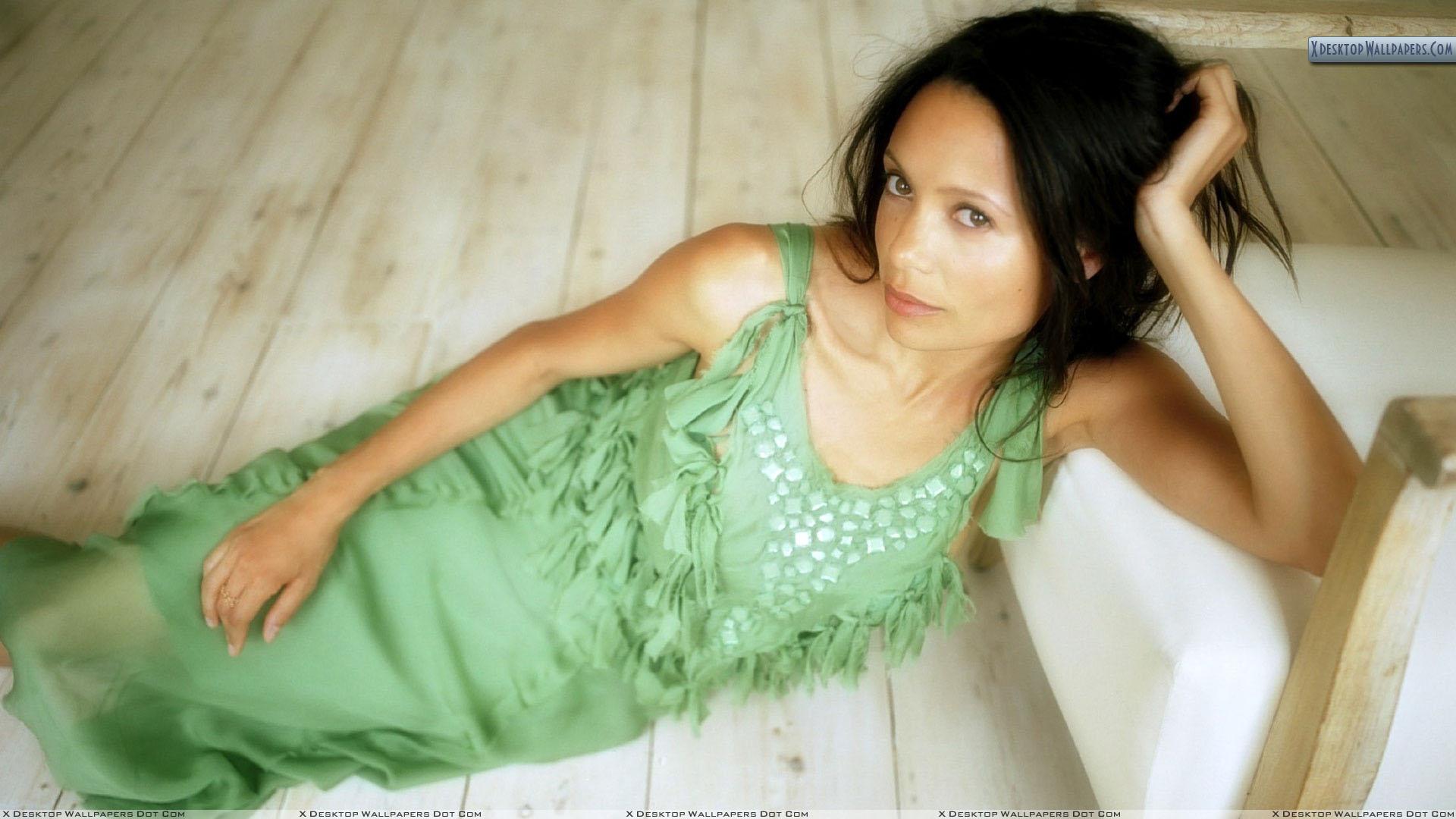1920x1080 Thandie Newton Laying In Green Dress Wallpaper