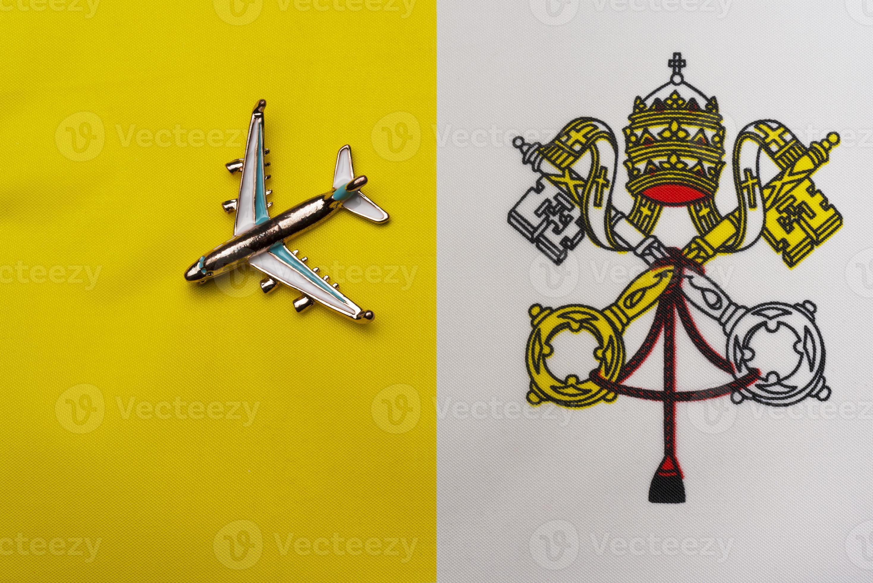 2936x1960 Plane over the Vatican city flag travel concept. Toy plane on a flag