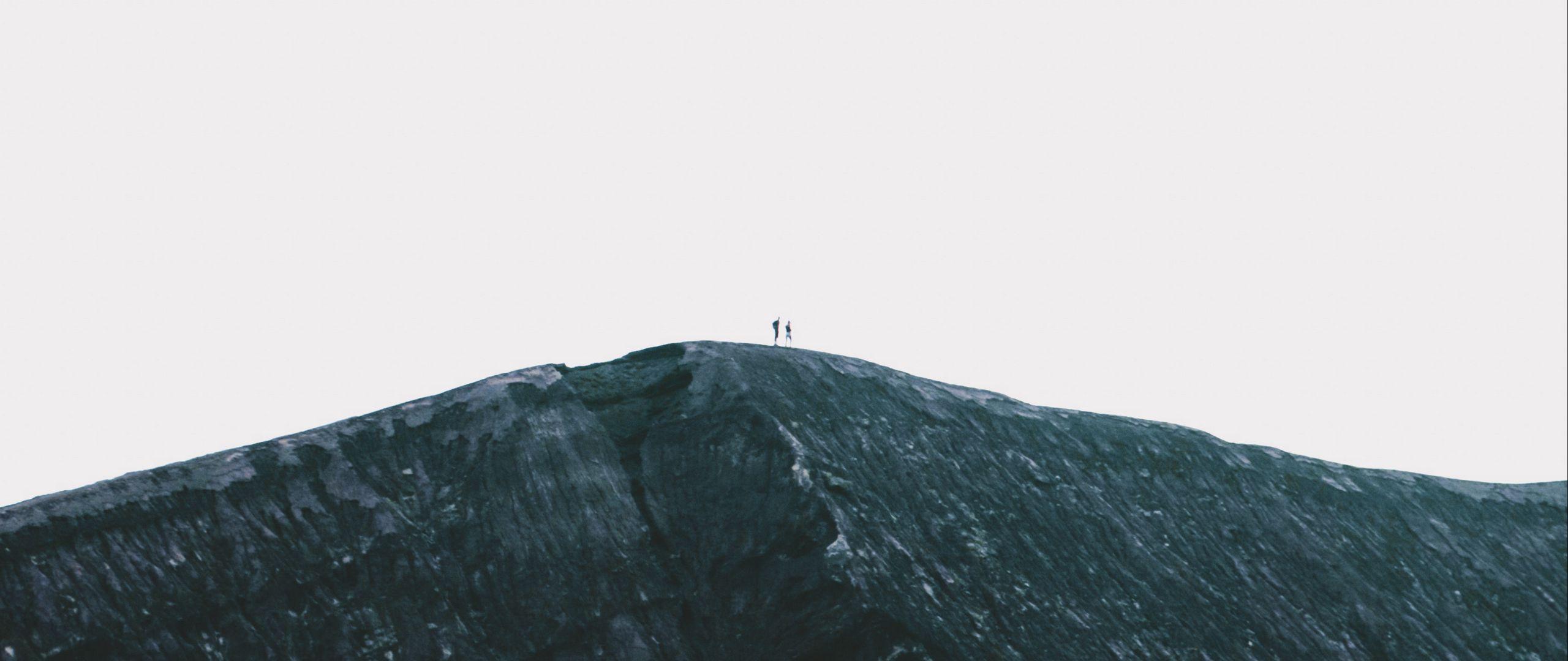 2560x1080 Download wallpaper 2560x1080 rock, mountain, silhouettes, top, sky, minimalism dual wide 1080p HD background