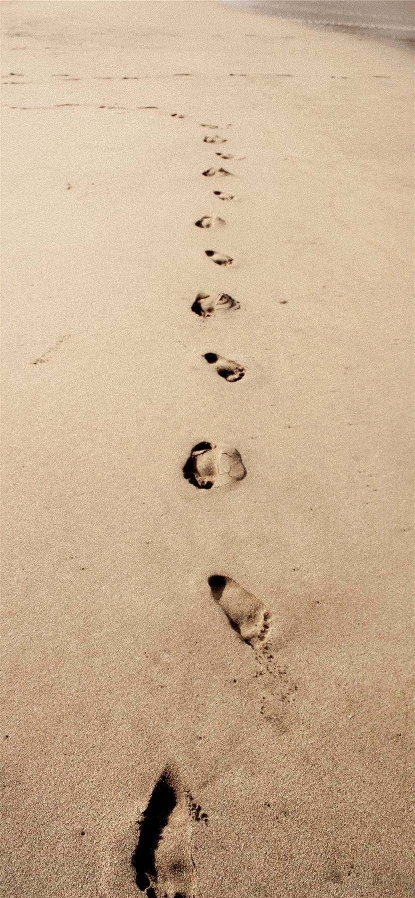828x1792 photo of footprints in the sand iPhone 11 Wallpaper Free Download