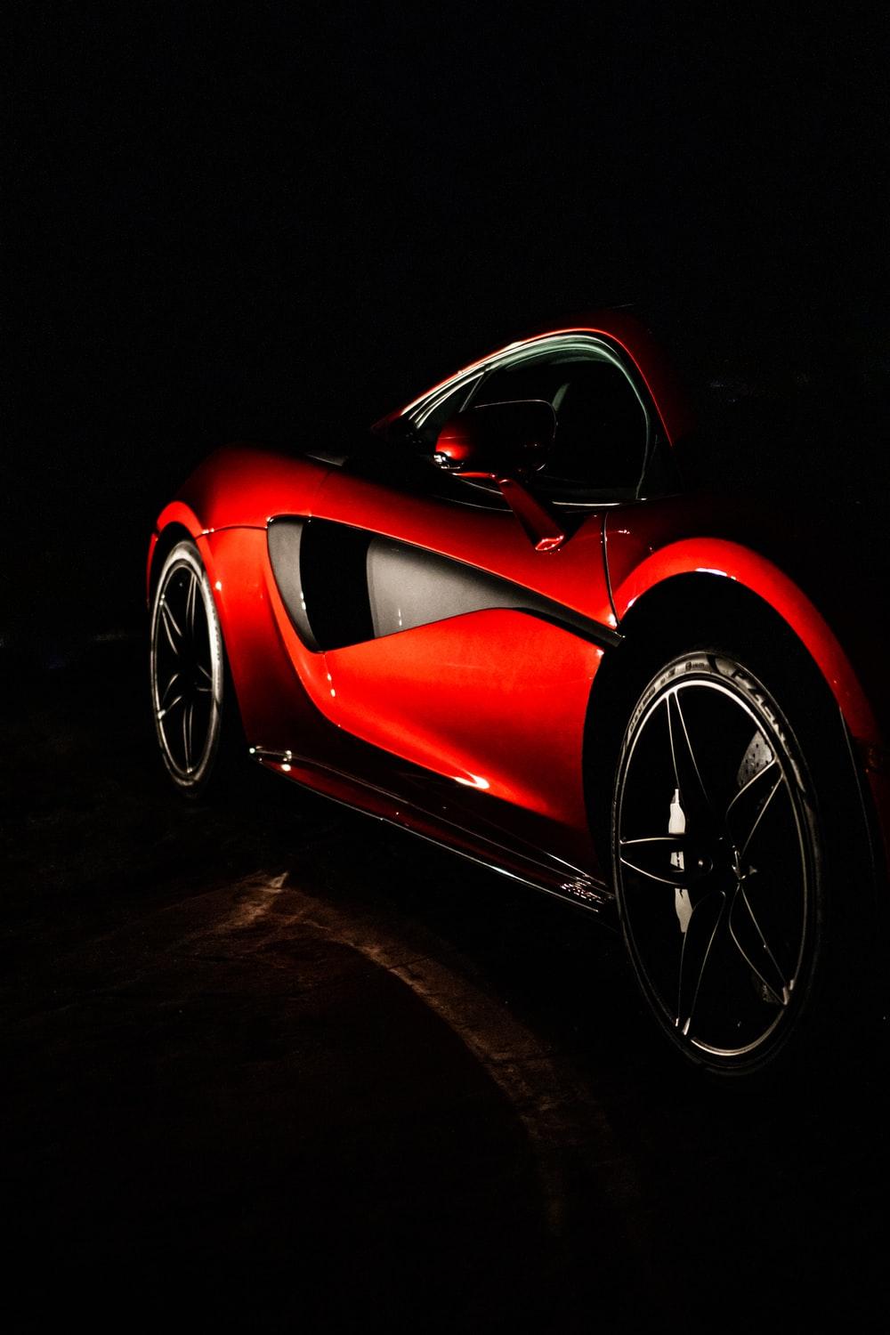 1000x1500 red ferrari 458 italia on black background photo