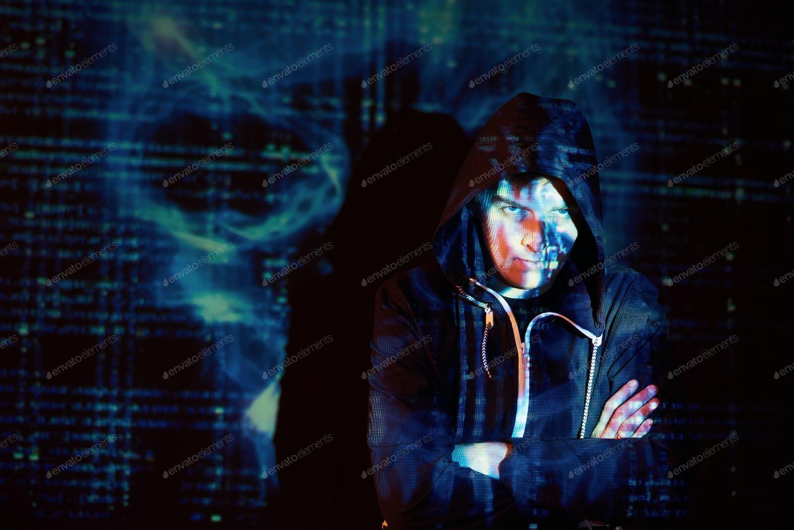 1600x1068 Cyber attack with unrecognizable hooded hacker using virtual reality, digital glitch effect photo by mstandret on Envato Elements