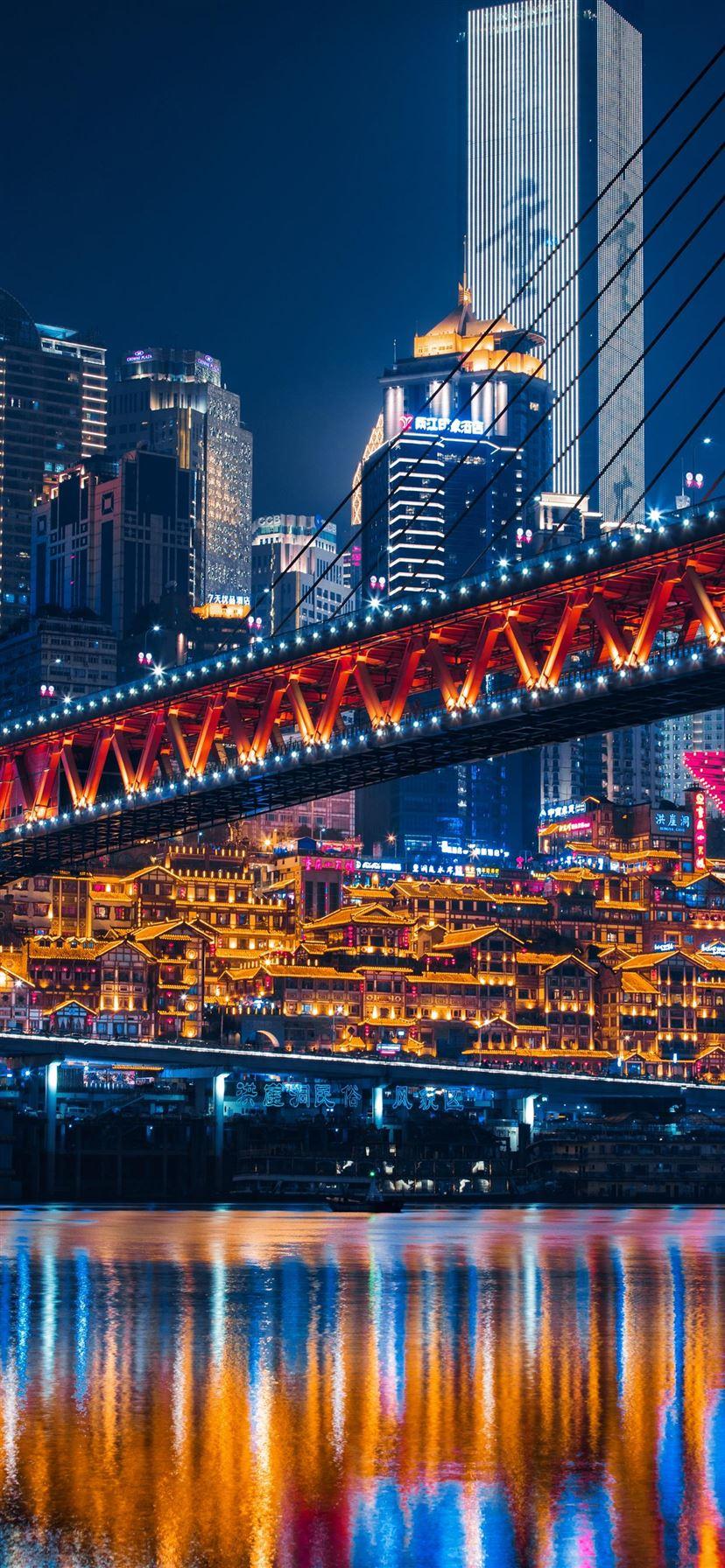 828x1792 lighted bridge across calm water iPhone 11 Wallpaper Free Download