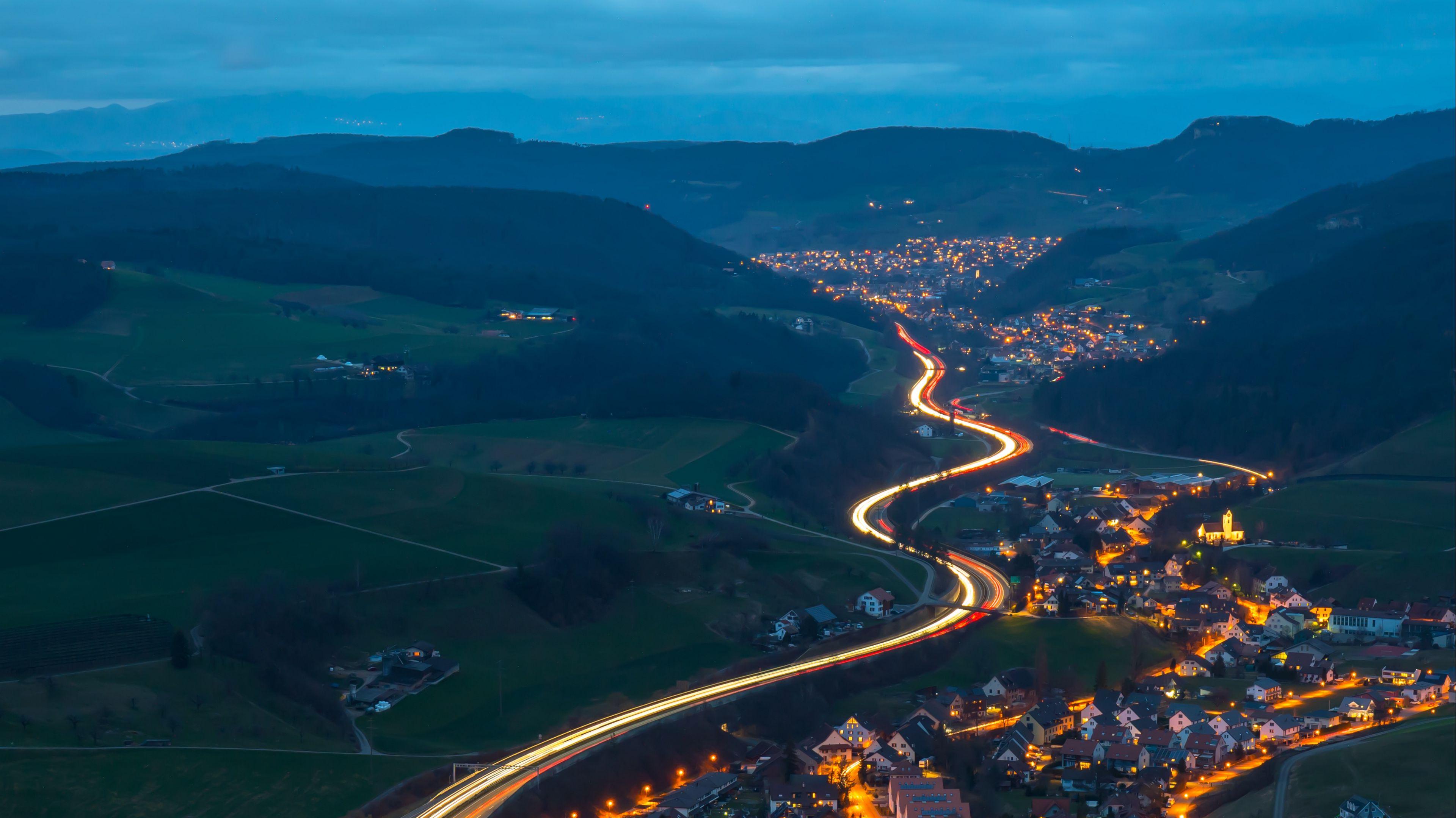 3840x2160 Download wallpaper 3840x2160 village, road, aerial view, night, mountains, switzerland 4k uhd 16:9 HD background