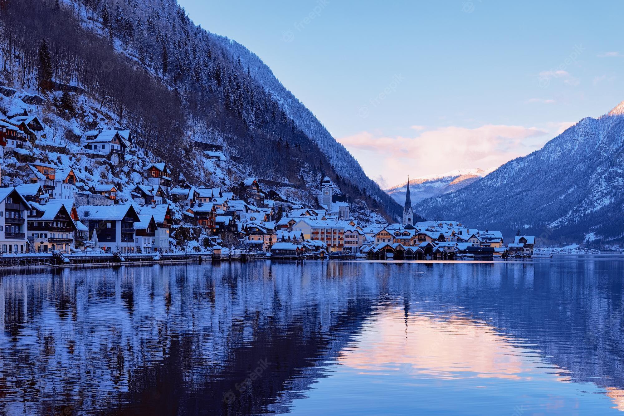 2000x1333 Premium Photo. Hallstatt near salzburg of austria, in europe. winter in salzkammergut. travel to austrian city with lake at christmas. alpine land with snow. view on village near alps mountains with