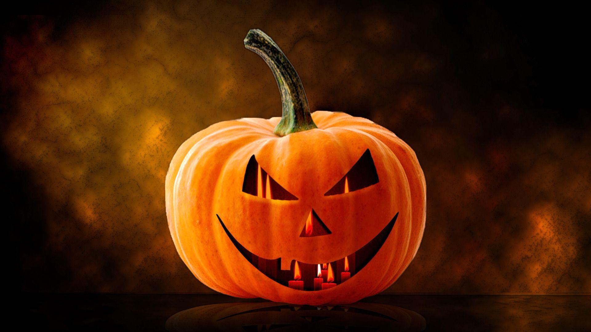 1920x1080 Candles Burning inside Halloween Pumpkin widescreen wallpaper. Wide