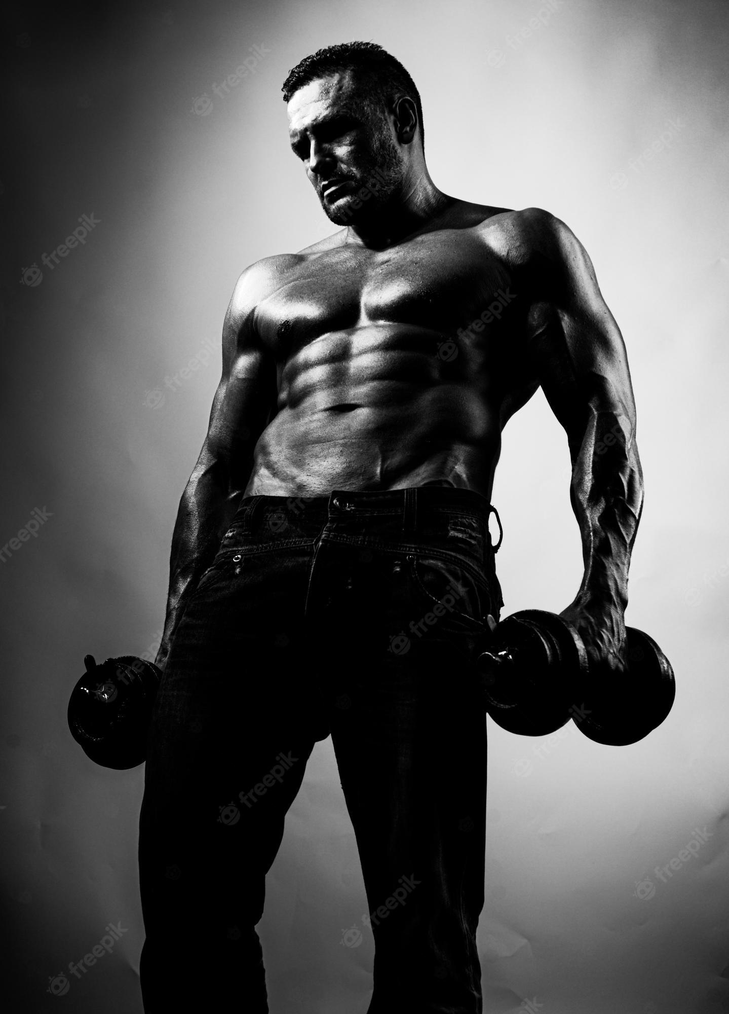 1439x2000 Premium Photo. Strong man with athletic body naked bodybuilder shirtless athletic man turned back on black background