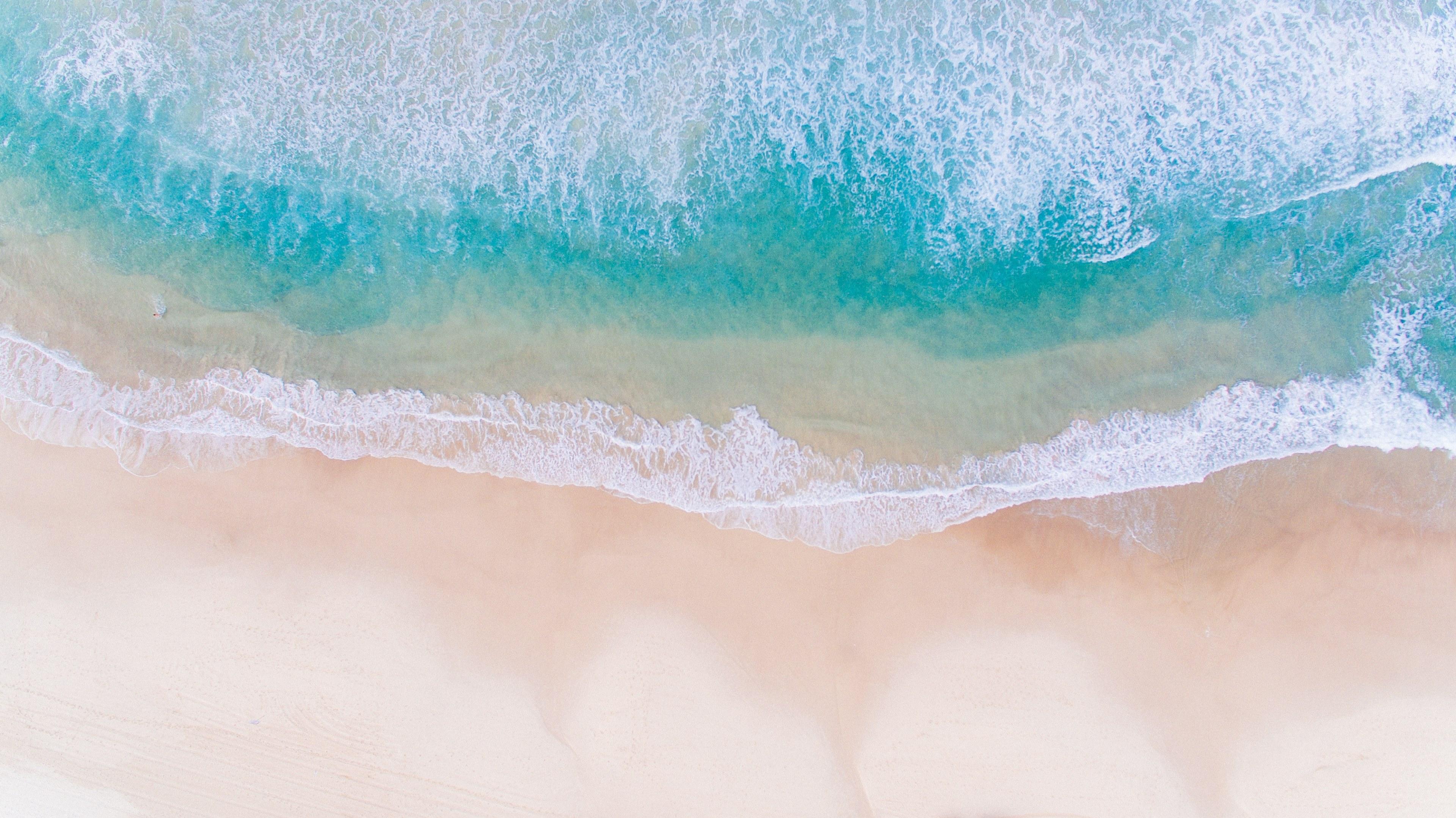 3840x2157 Wallpaper / drone view of the ocean washing on the rocky shore by the hotels in durban, drone view of ocean coastline 4k wallpaper free download