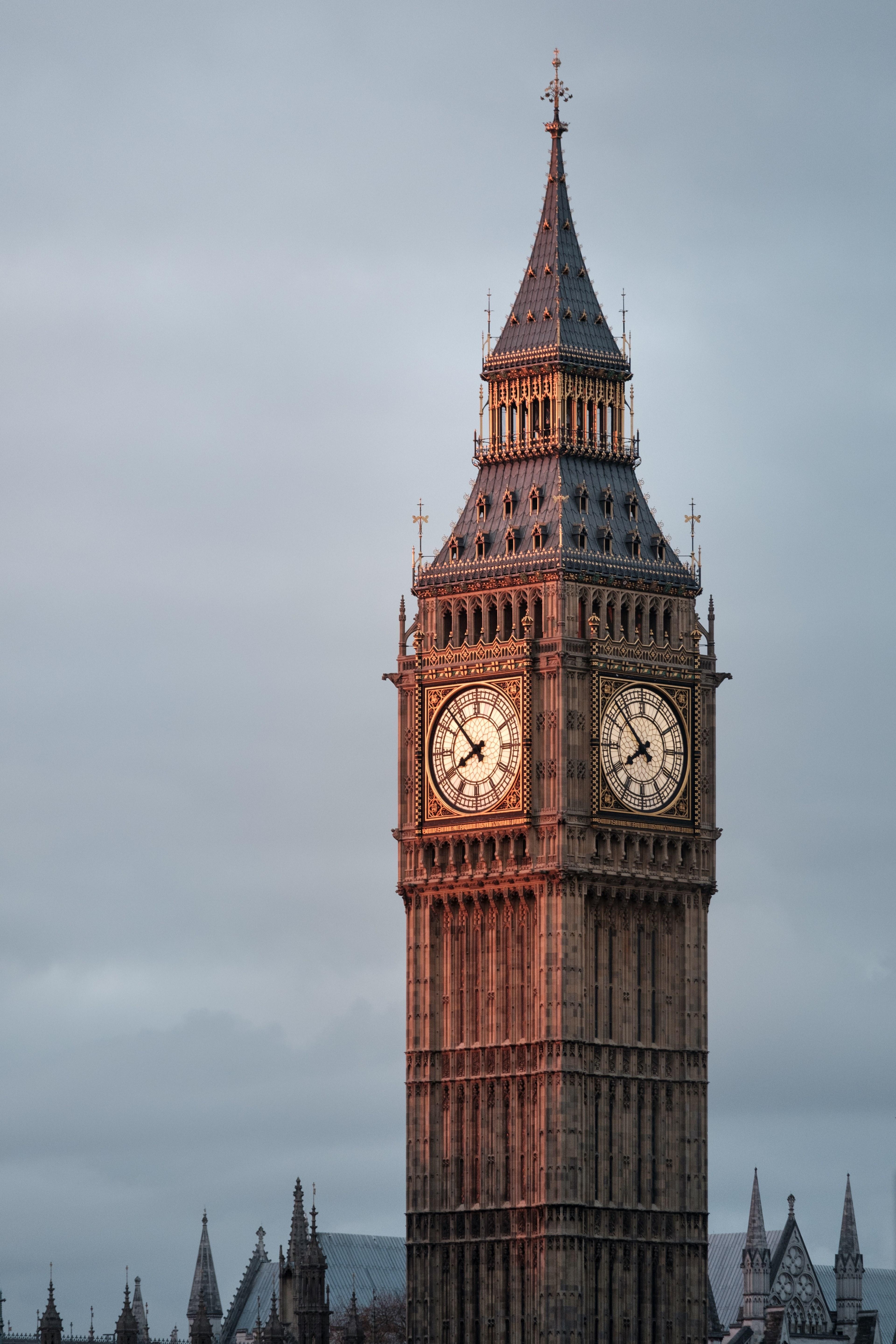 3840x5760 Wallpaper / big ben clock tower in the early light of morning with the sun shining on the clock face, big ben in the morning 4k wallpaper free download