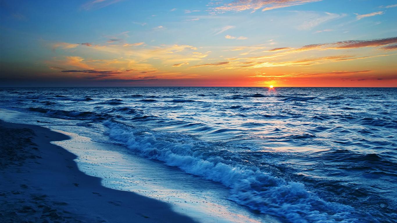 1366x768 Photos Sea Sun Nature Waves sunrise and sunset 1366x768