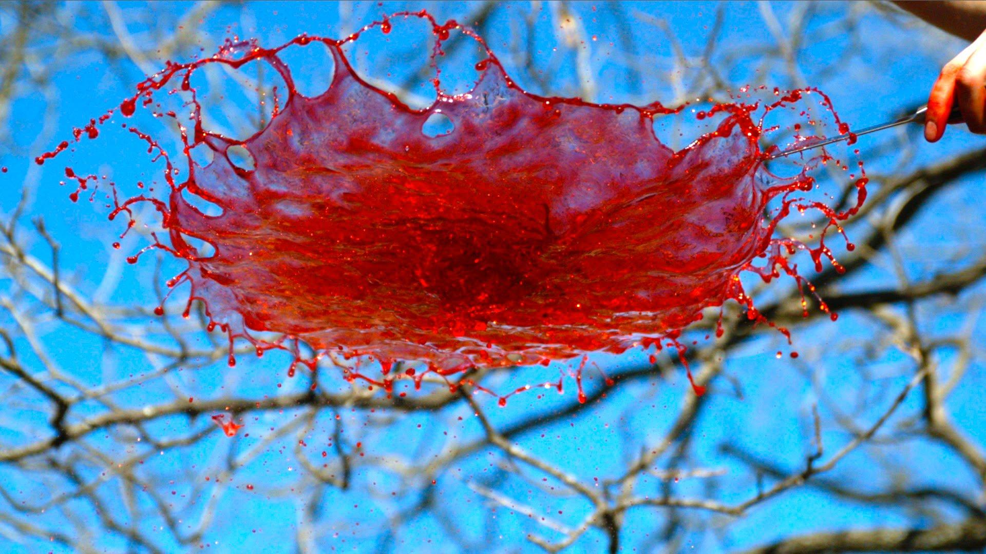 1920x1080 Slow Motion Video Of Spinning Fluid Physics Being Demonstrated Using Condoms
