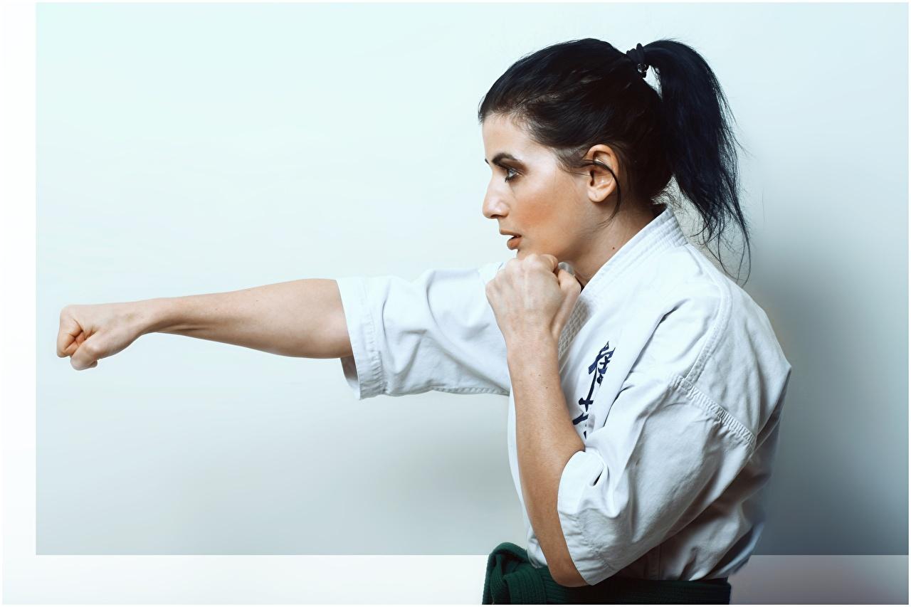 1280x853 Image young woman Side Brunette girl Karate Hands Fist To hit