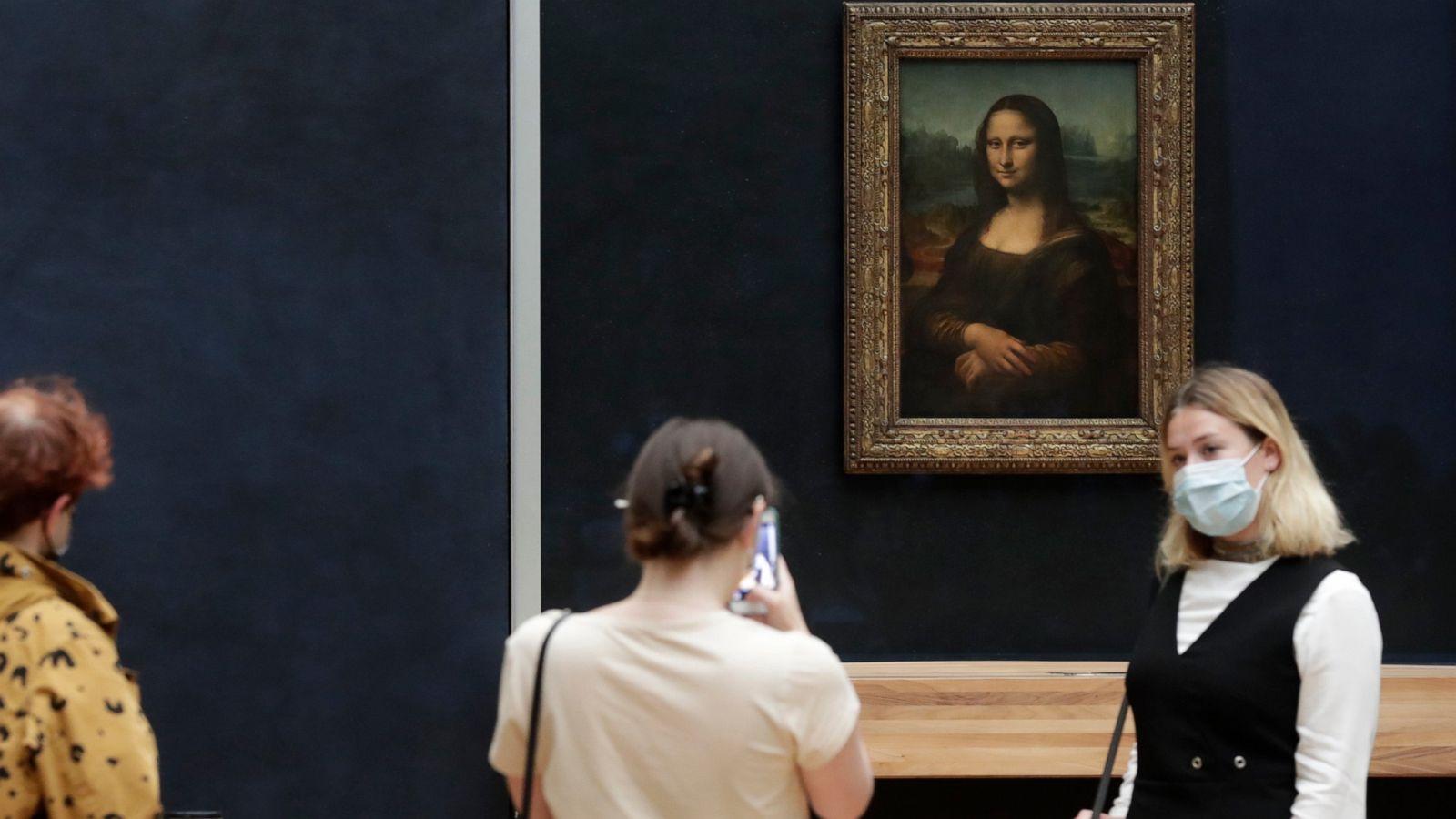 1600x900 Man in wig throws cake at glass protecting Mona Lisa
