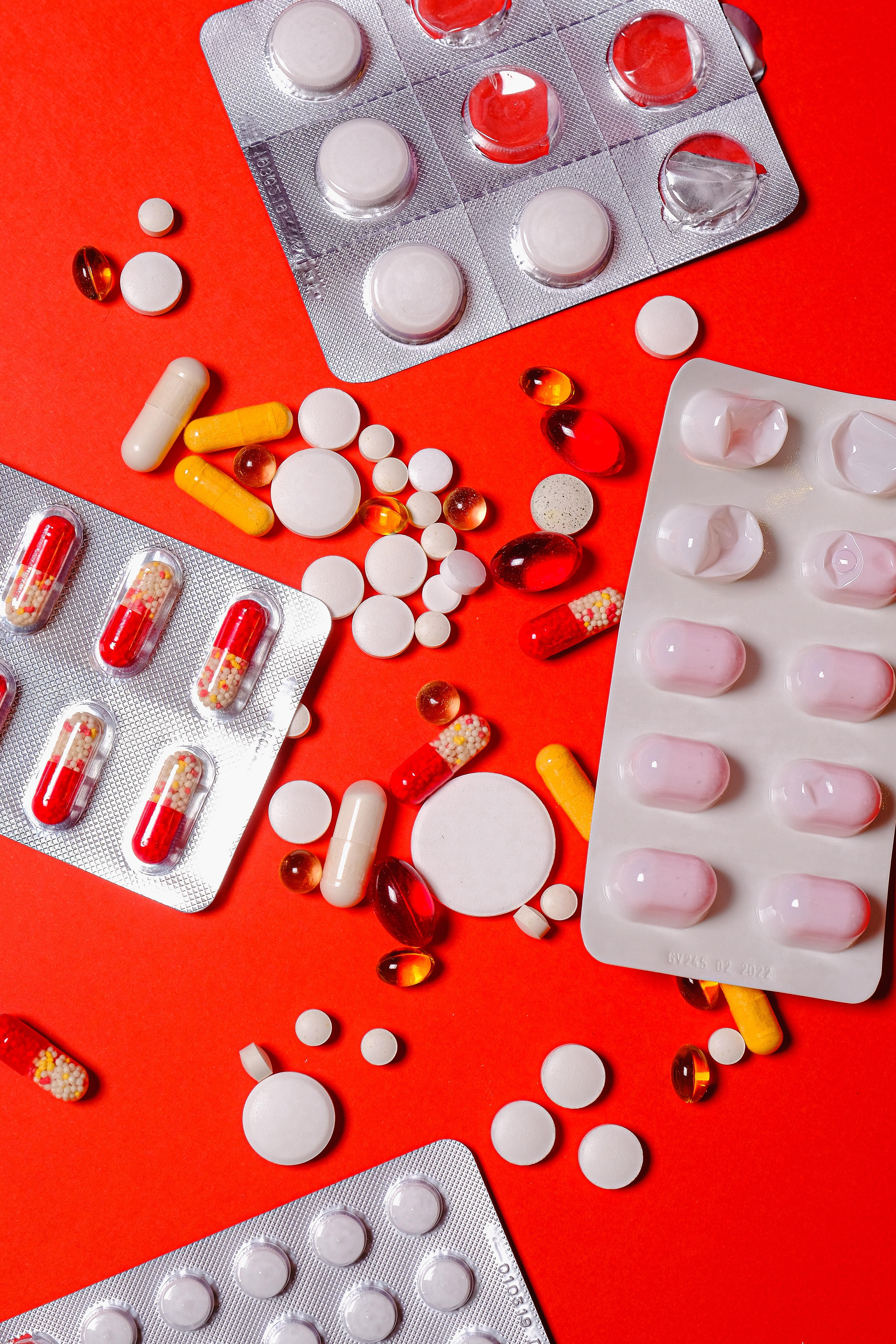 4000x6000 White Capsules on Yellow Background · Free