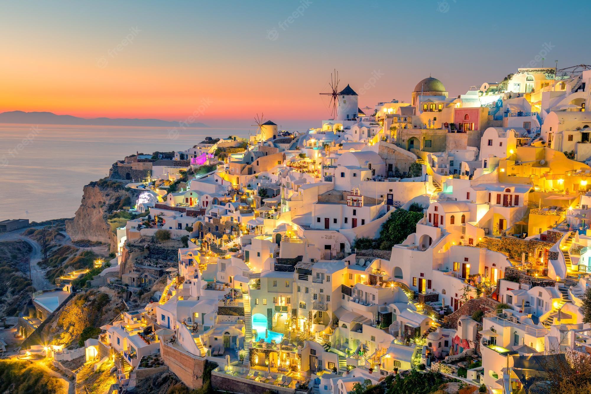 2000x1334 Premium Photo. Sunset night view of traditional greek village oia on santorini island in greece santorini is iconic travel destination in greece famous of its sunsets and traditional white architecture