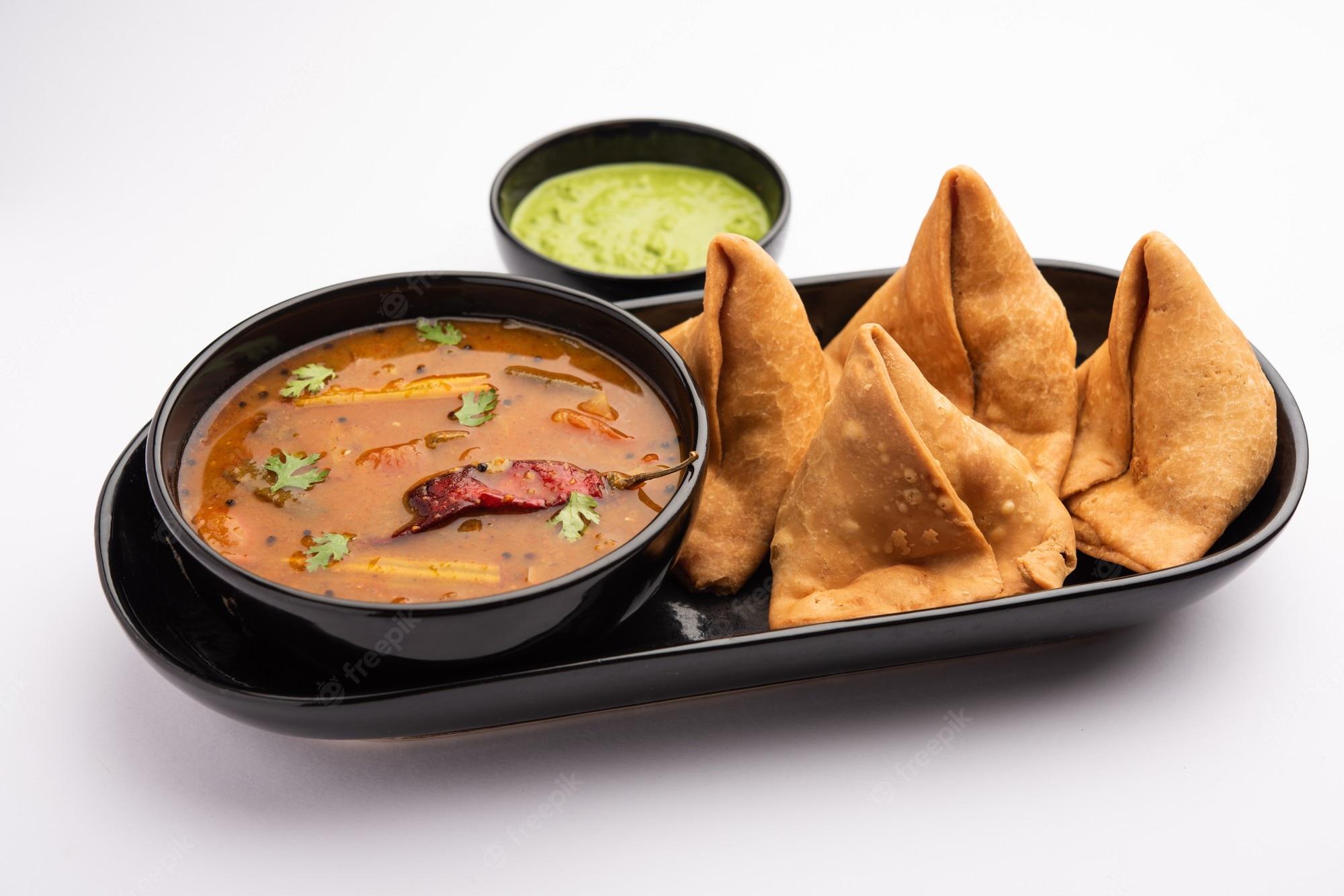 2000x1334 Premium Photo. South indian sambar samosa chutney it's a fusion food in which sambhar is from south and samosas are from north india