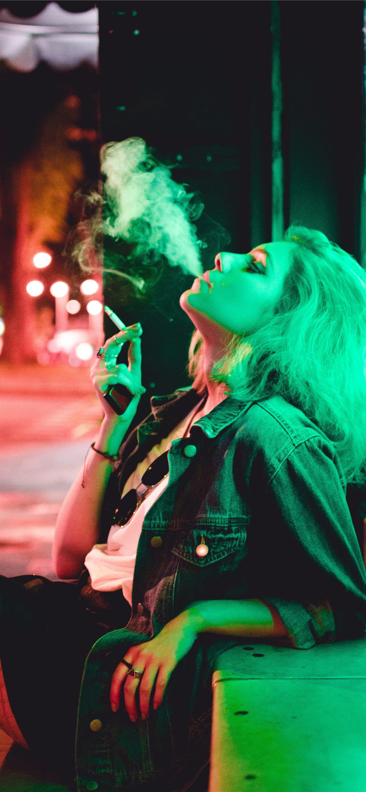 1284x2778 woman smoking during nighttime iPhone Wallpaper Free Download