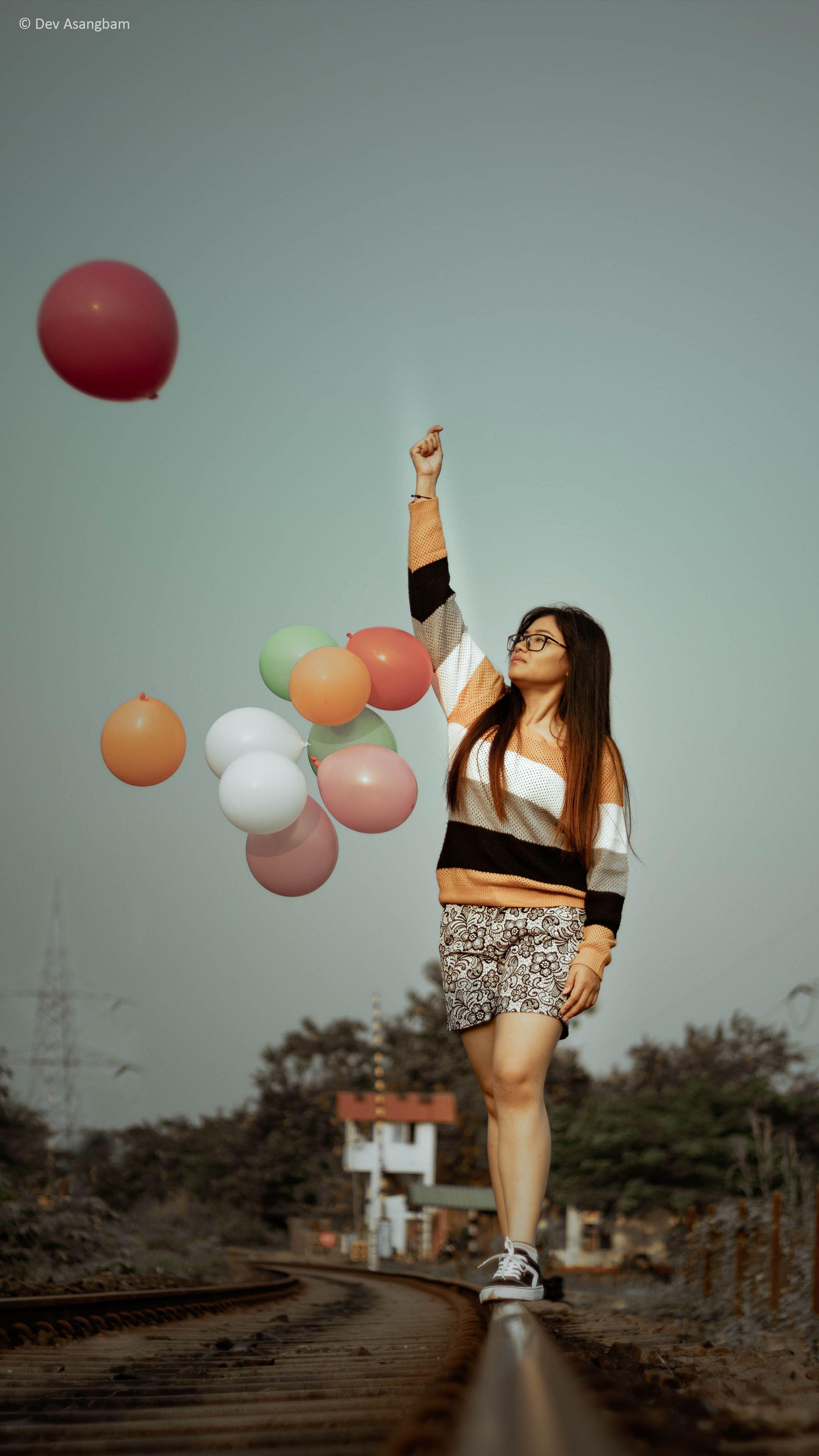 2160x3840 Asian Girl Balloons Train Track Photography 4K Ultra HD Mobile
