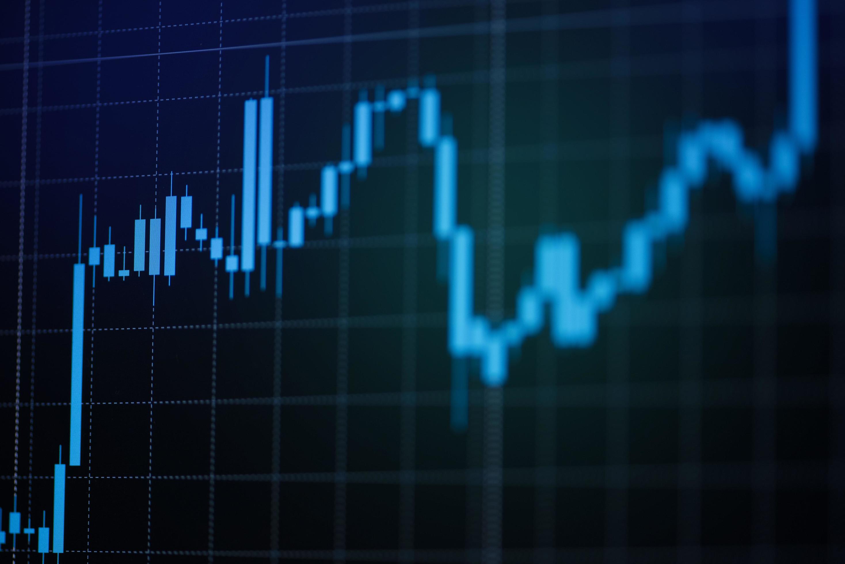 2936x1960 Stock market exchange graph price with investment of business financial digital background stick charts stock or forex trading indicator on computer monitor for investors