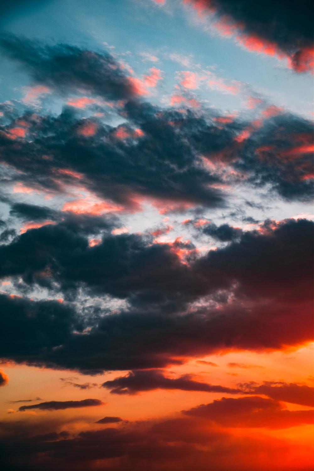 1000x1500 black clouds and orange sky photo